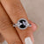 Round rose cut moissanite engagement ring with round cut design.