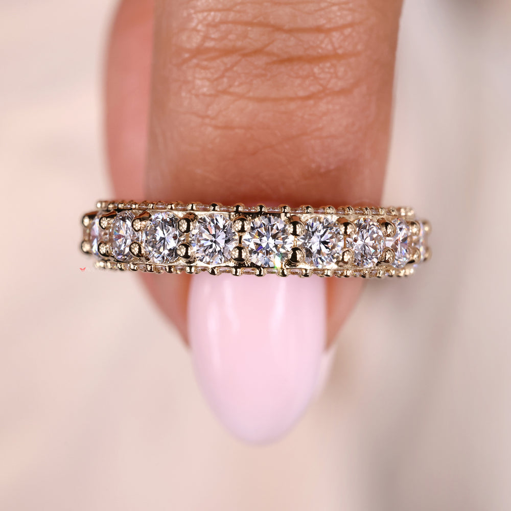 Yellow gold eternity band with round diamonds for an elegant and lasting design.
