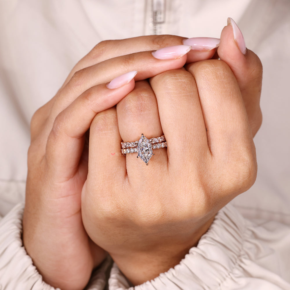 Marquise ring with claw prong and eternity band.
