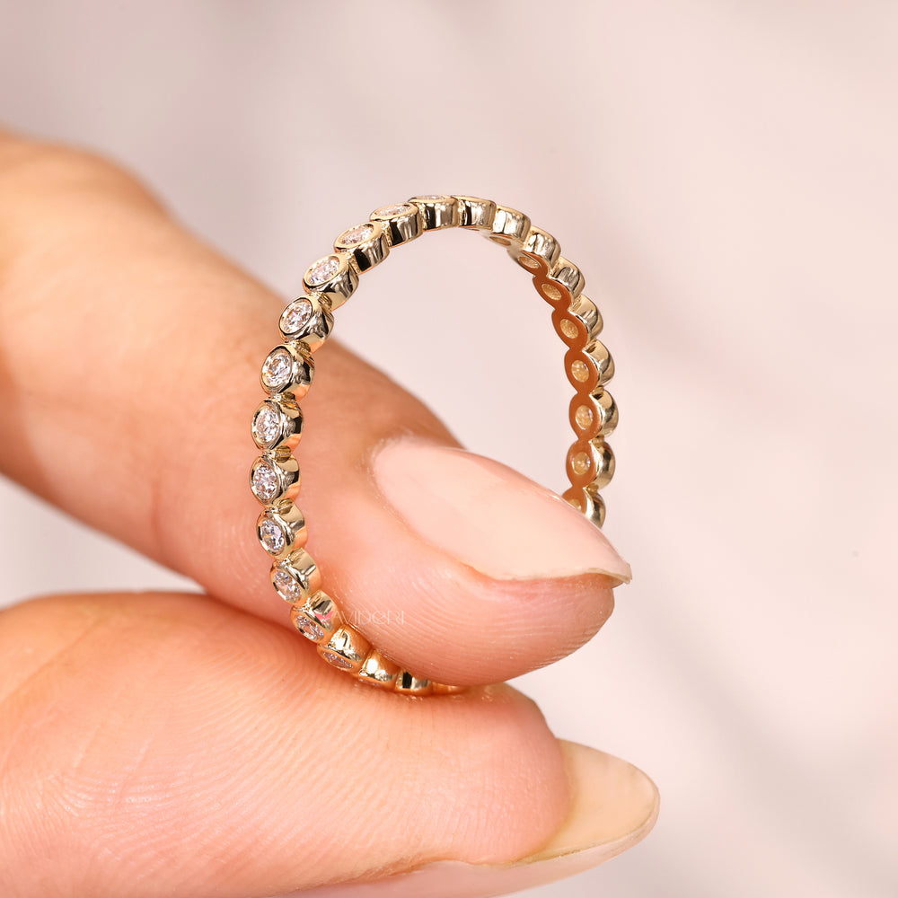 Round diamond band with bezel setting design.
