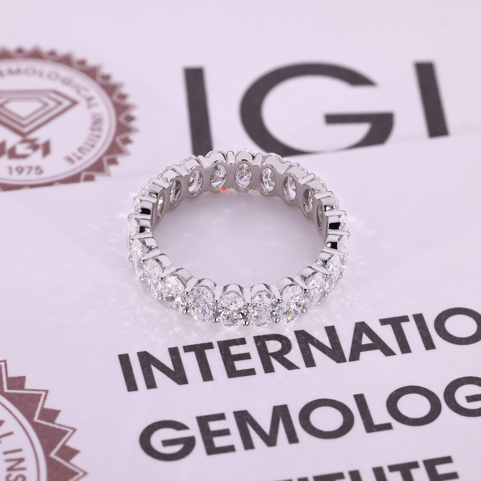 White gold oval diamond eternity band.