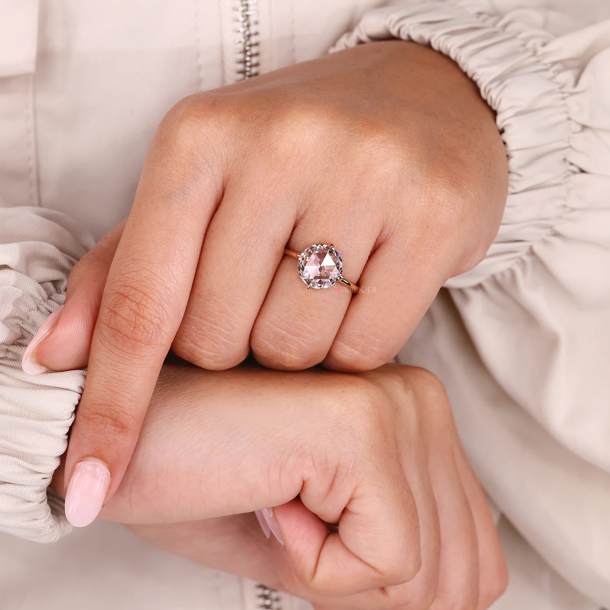 Round cut hidden halo with solitaire engagement ring.