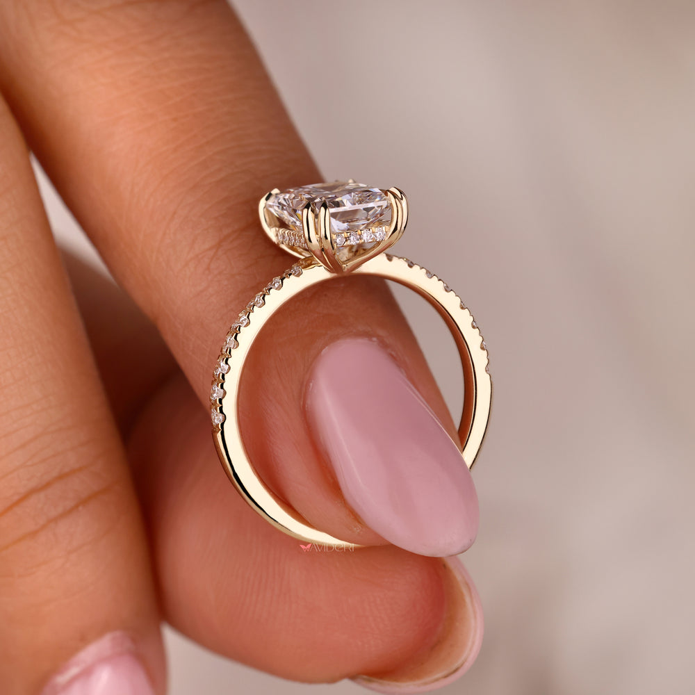 Radiant engagement ring in a classic yellow gold setting.
