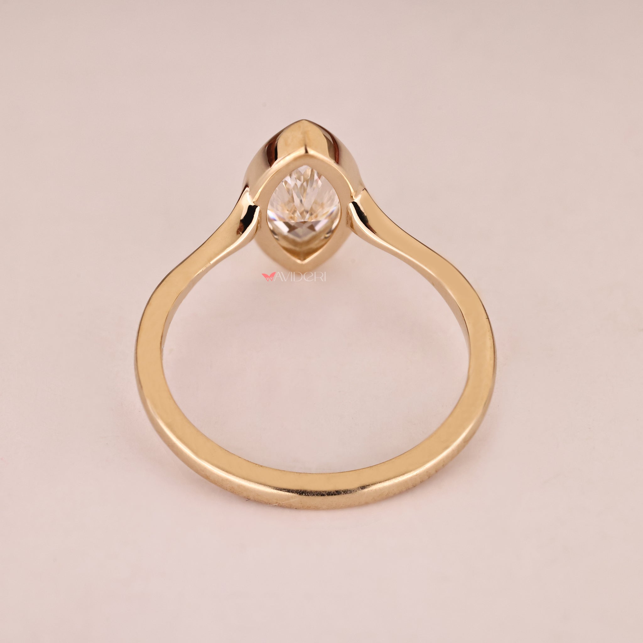 Yellow gold engagement ring with handmade design.