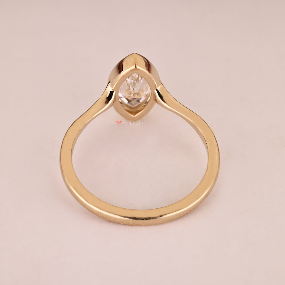 Yellow gold engagement ring with handmade design.