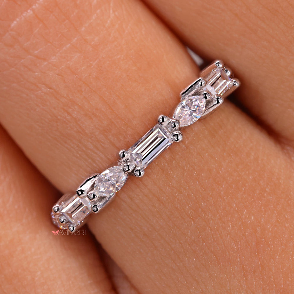 Handmade jewelry featuring a diamond wedding band.
