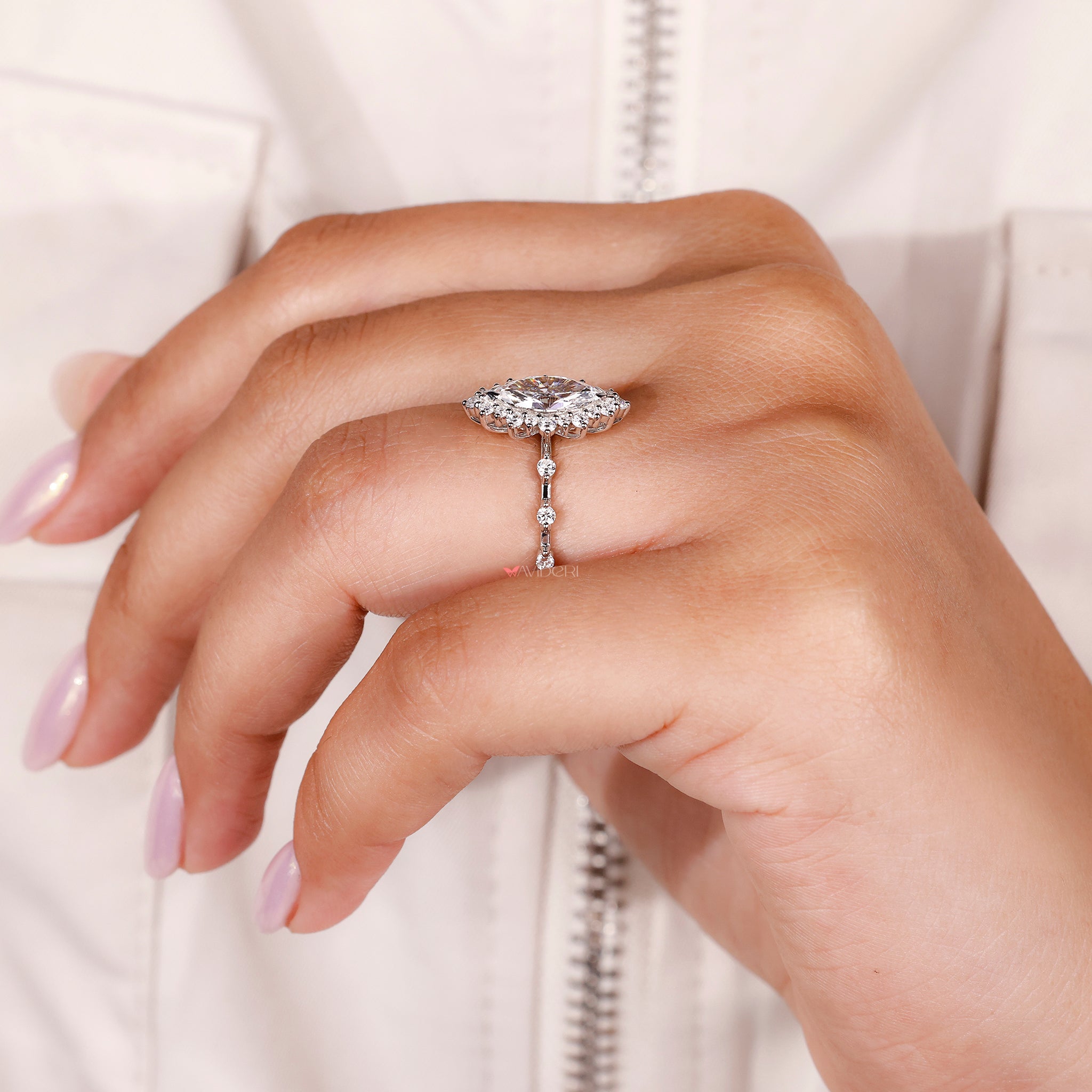 marquise and round diamond engagement ring with v-prong setting and custom band.