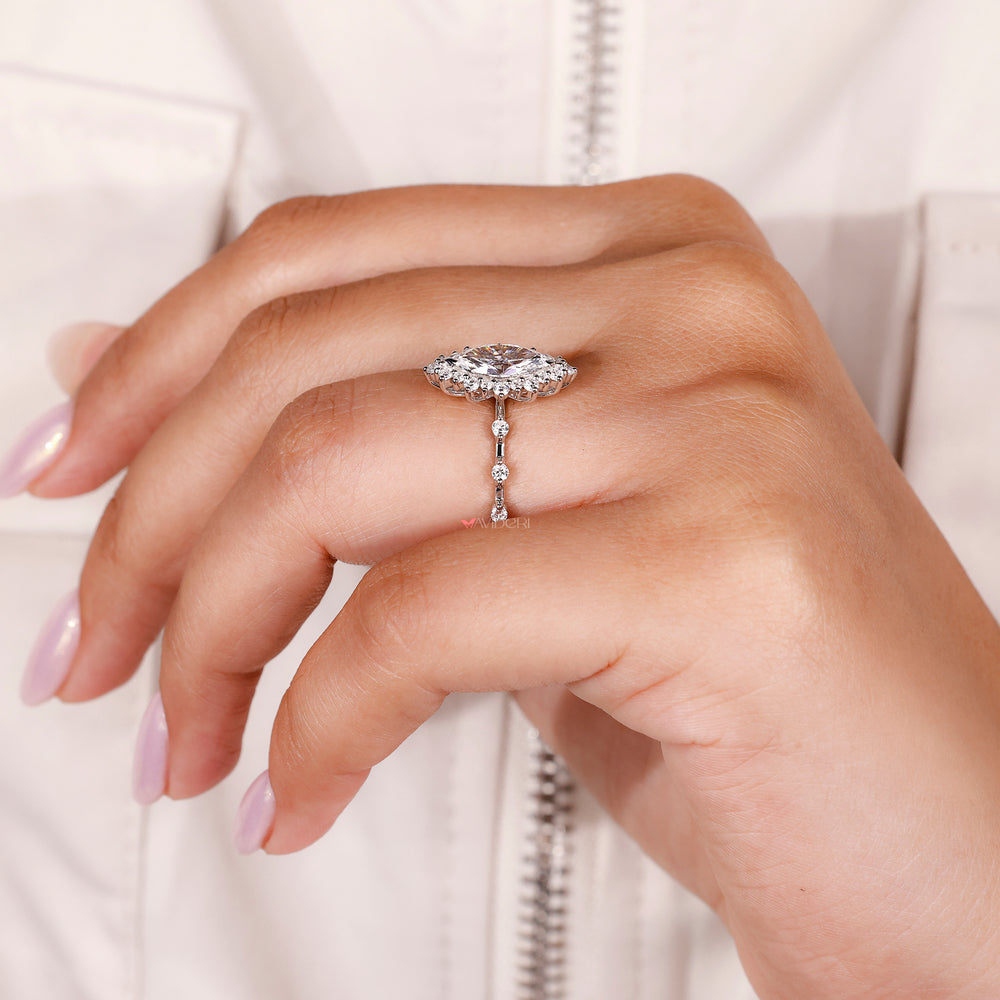marquise and round diamond engagement ring with v-prong setting and custom band.
