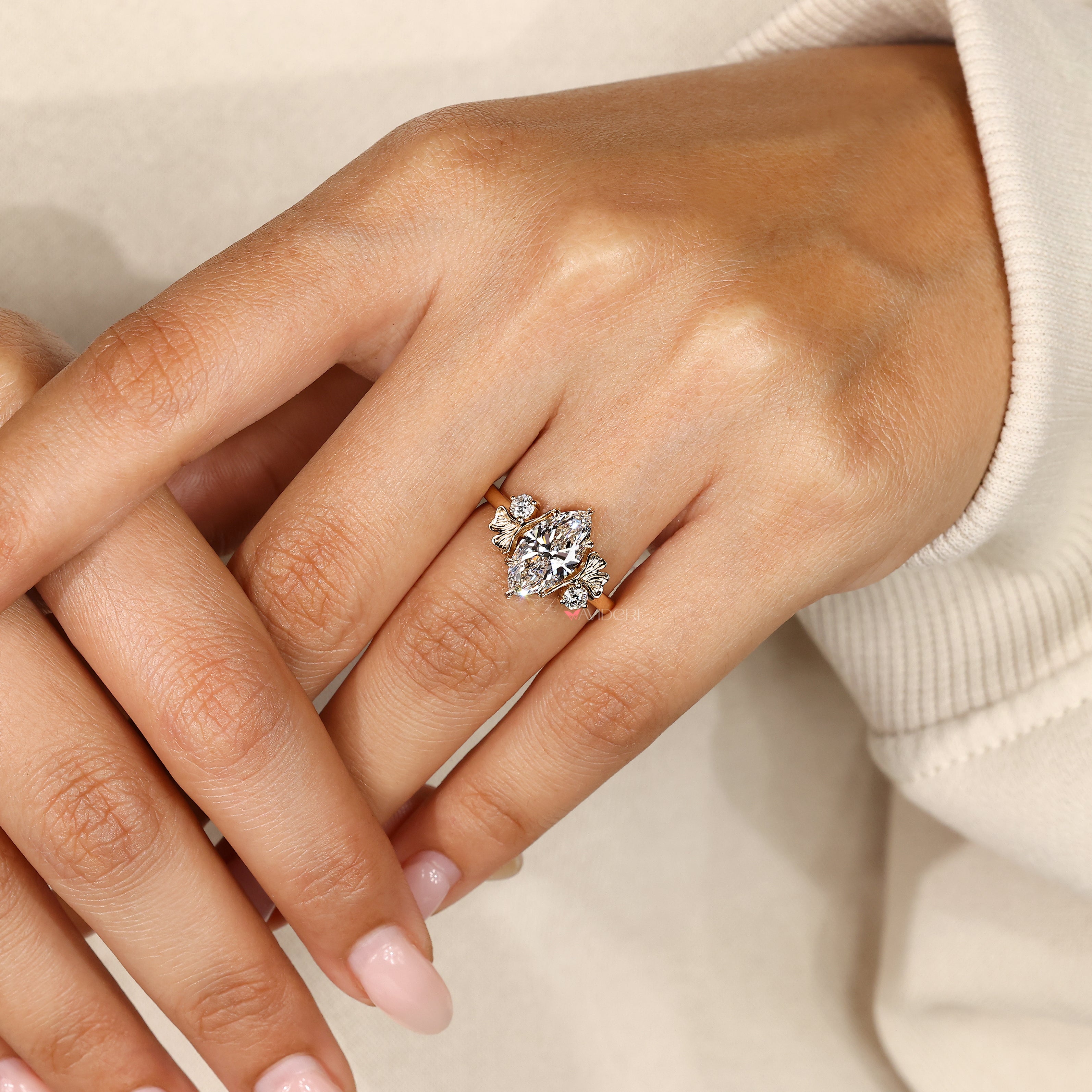 Nature inspired marquise ring with round diamonds.
