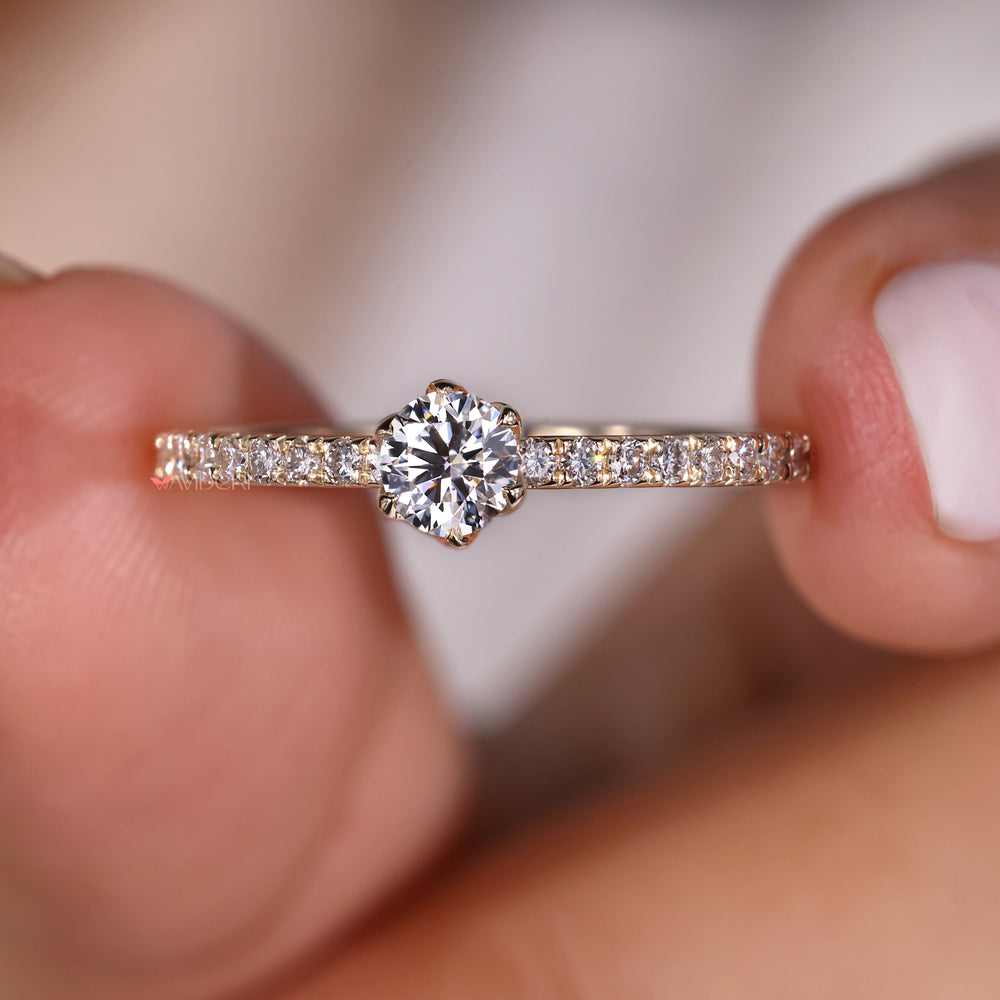 6 prong ring with round diamond setting for a secure and elegant look.
