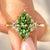 Marquise cut diamond engagement ring with blooms.
