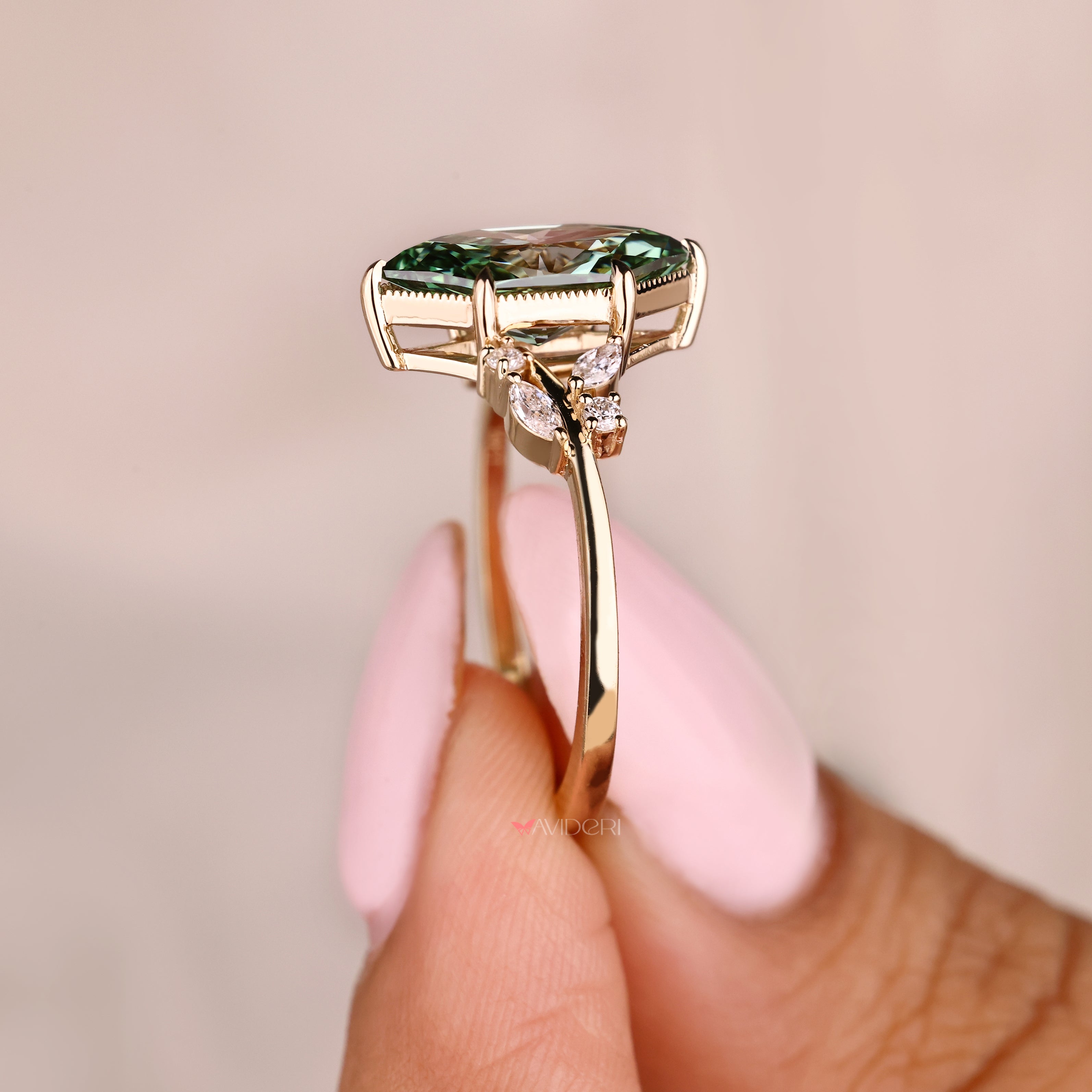 Handmade marquise diamond ring with round side stone accents
