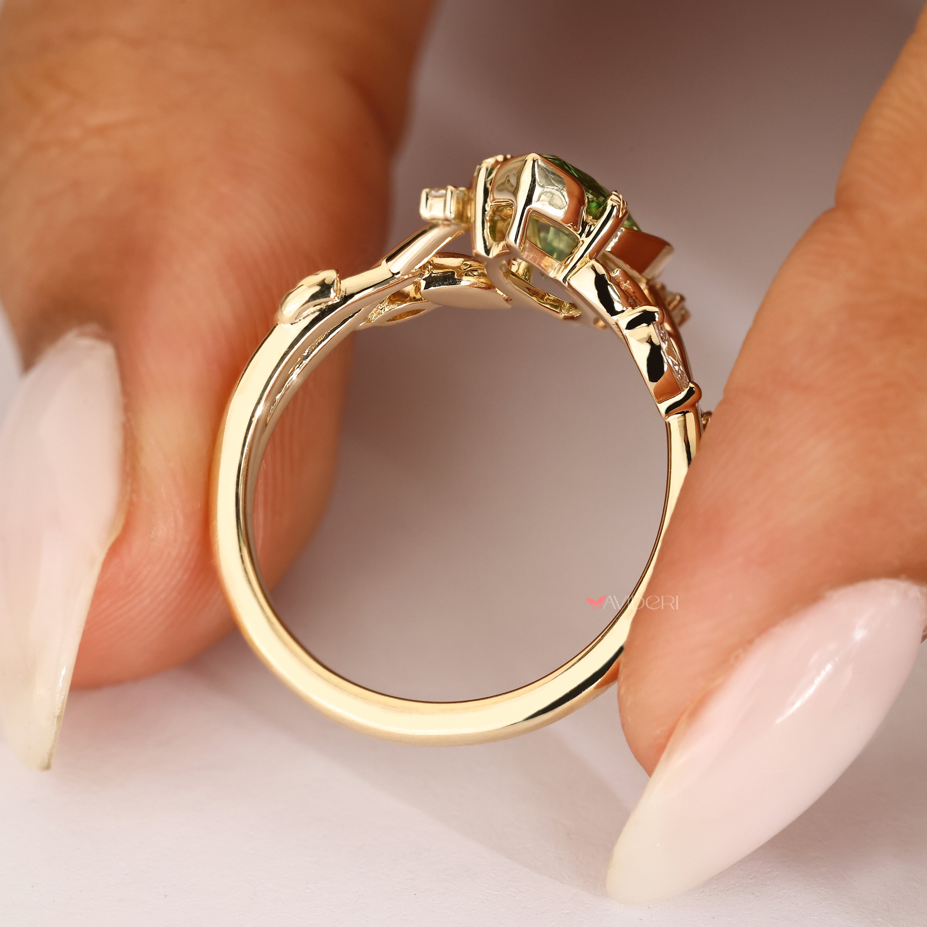 Marquise ring with delicate leaf and vine detailing.
