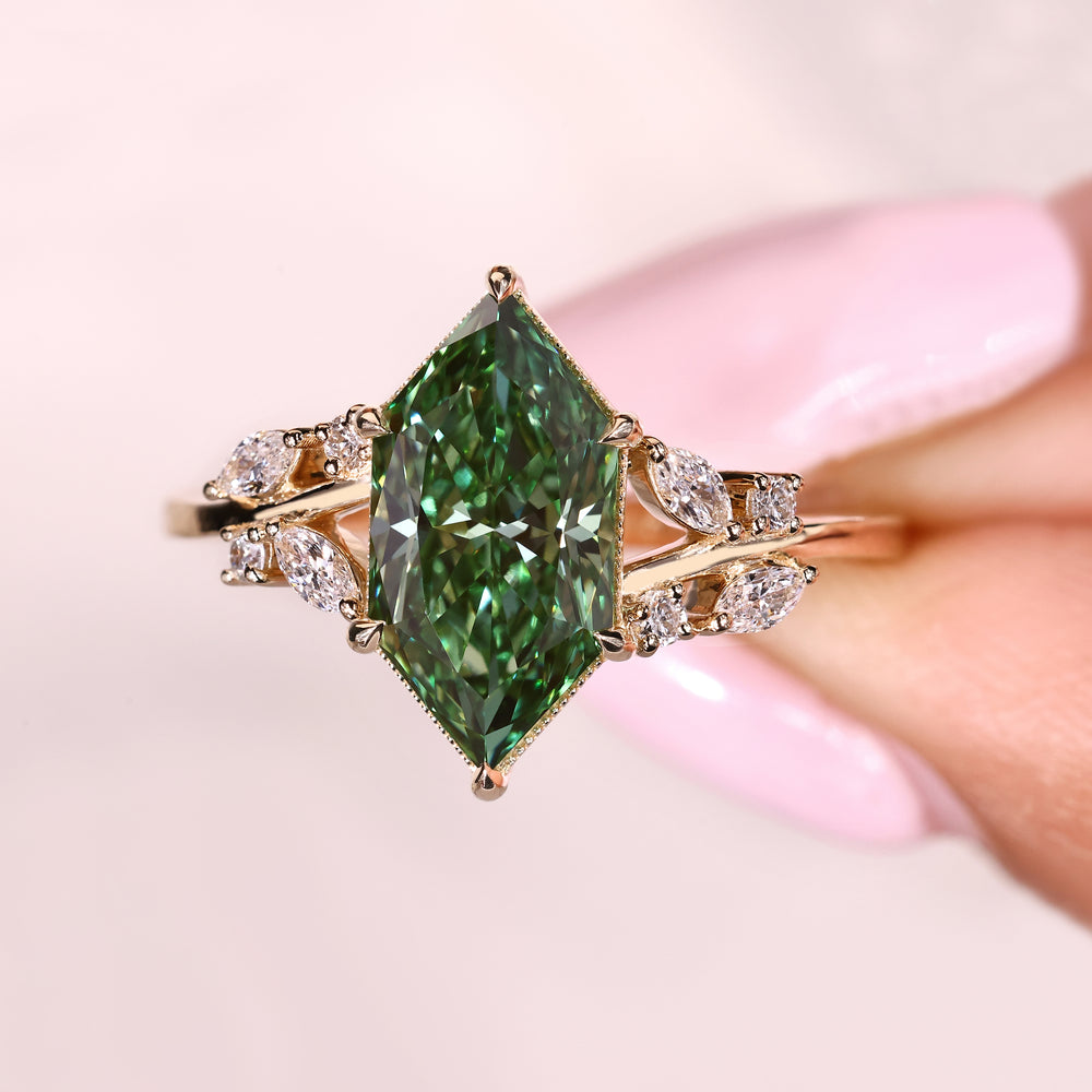 Green center diamond ring with marquise side stone details

