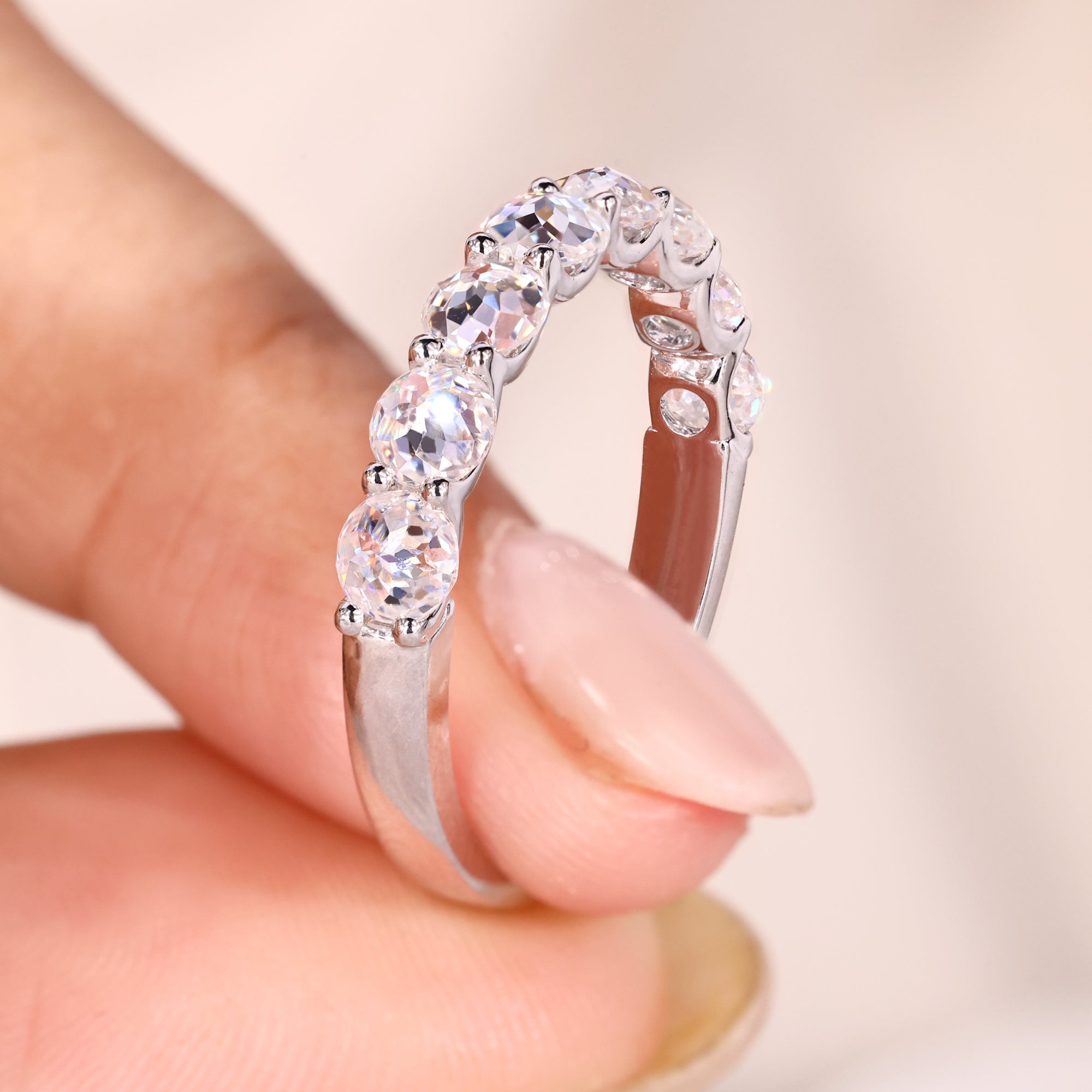 Half eternity band showcases subtle brilliance with stones set halfway around the band.