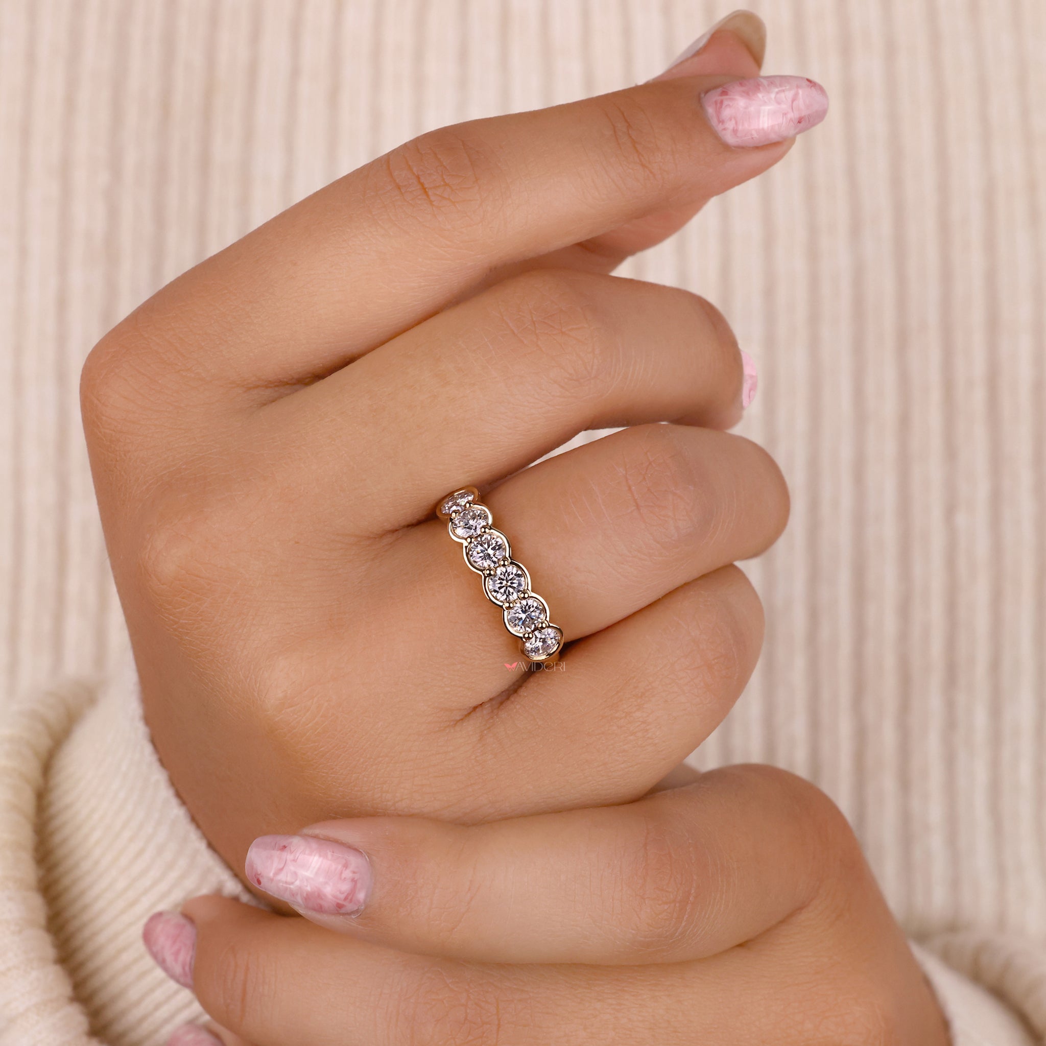 Handmade yellow gold band with lab grown diamonds.
