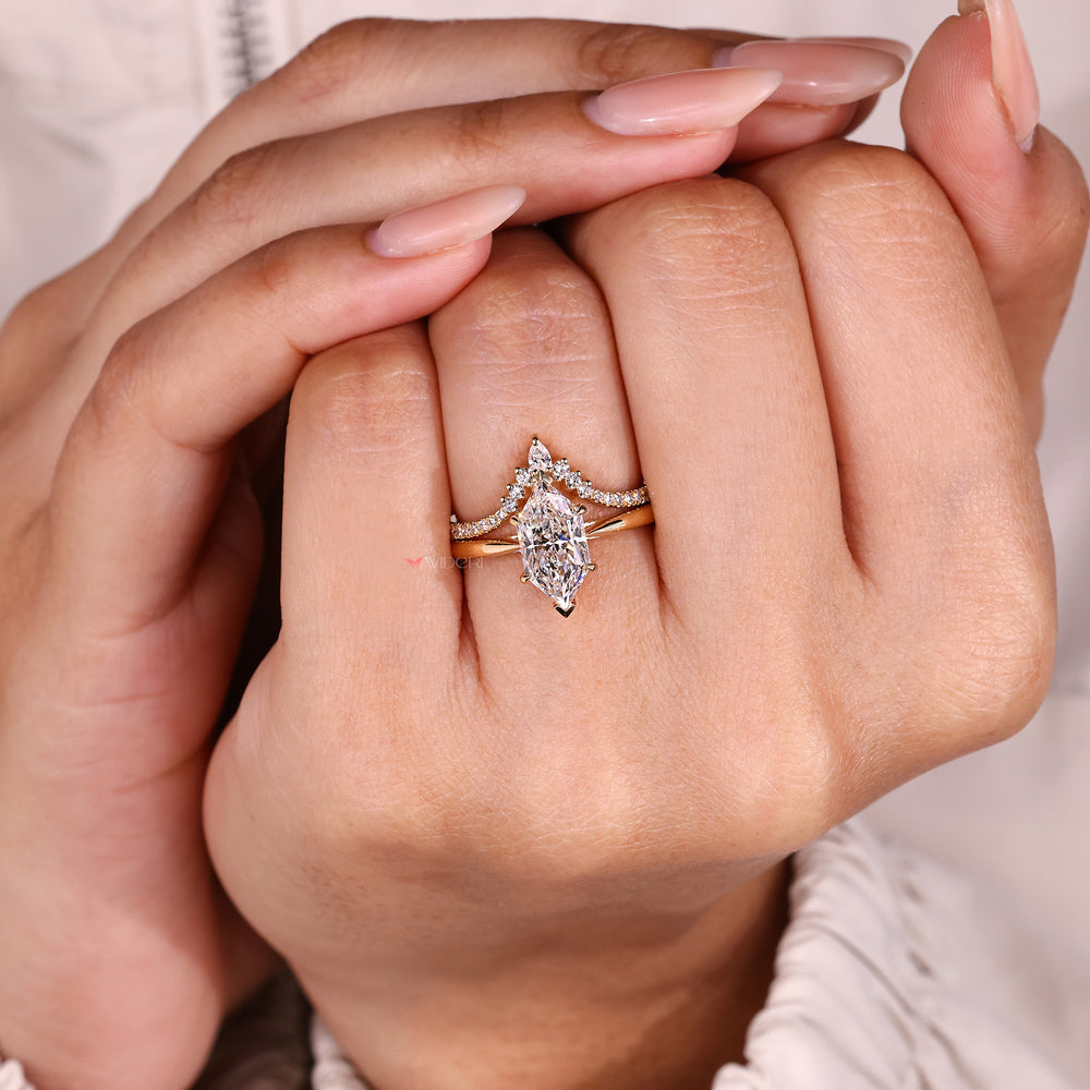 Dutch marquise solitaire ring with matching band.
