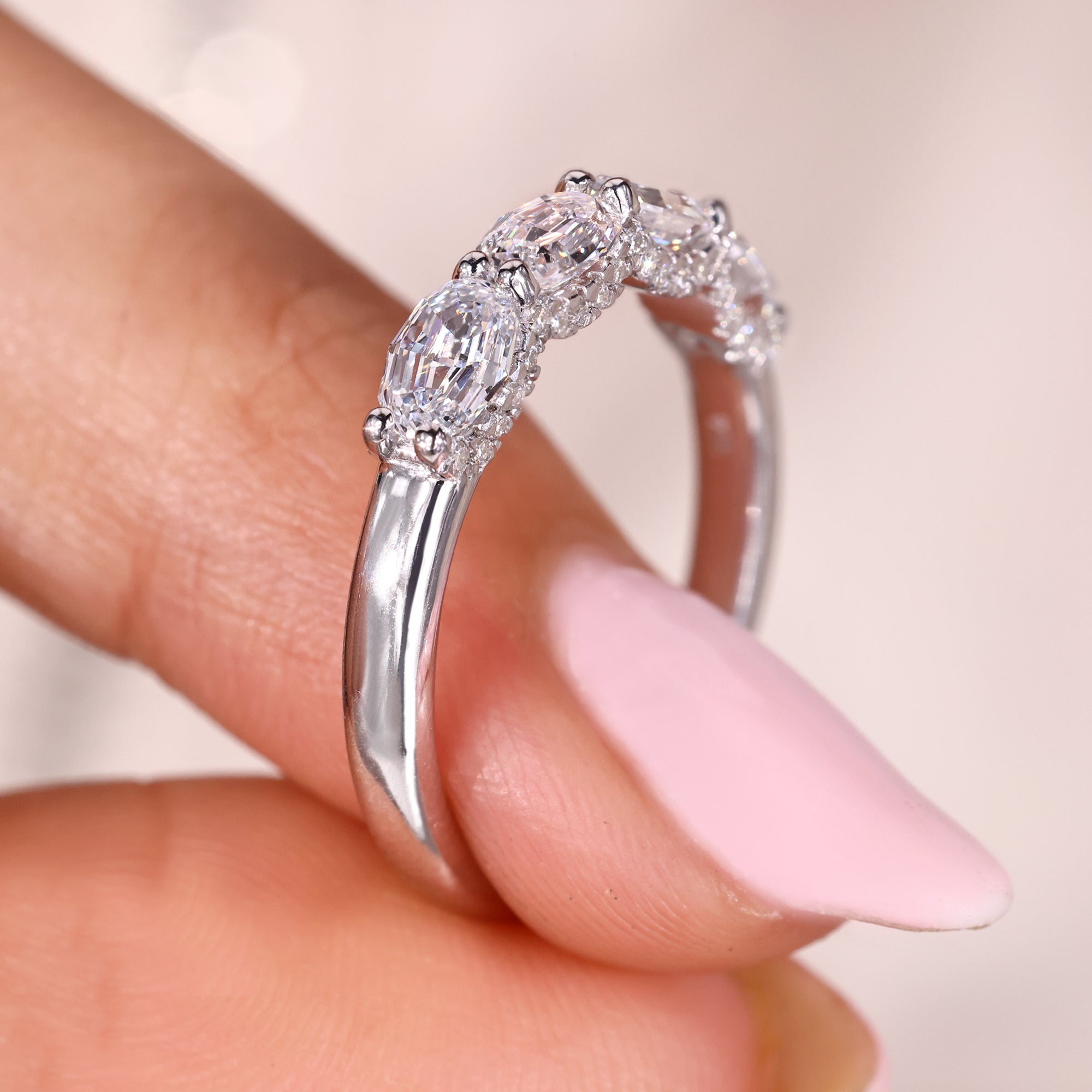 Side halo wedding band in white gold wedding band.