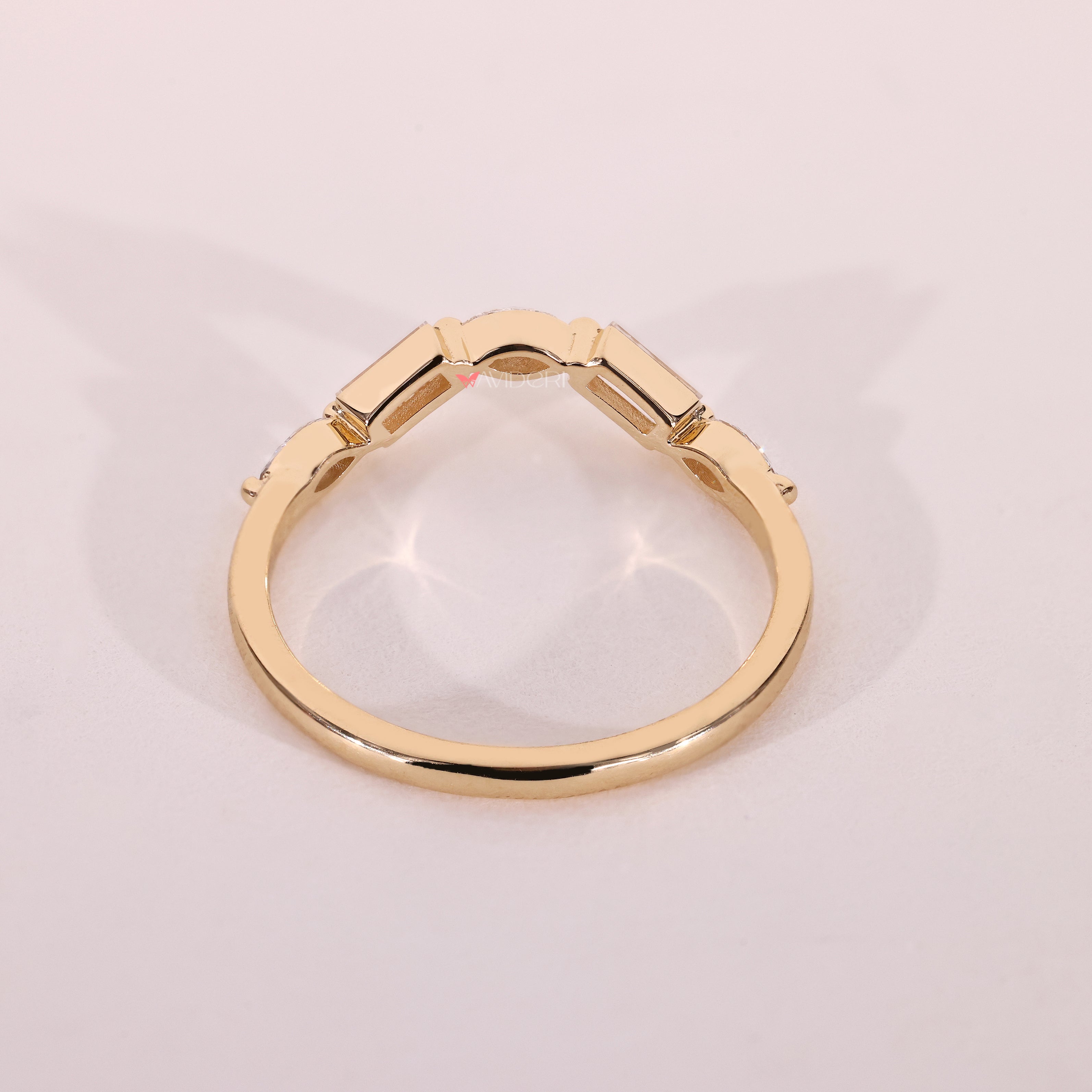 Five stone curved wedding band with mixed diamond shapes.
