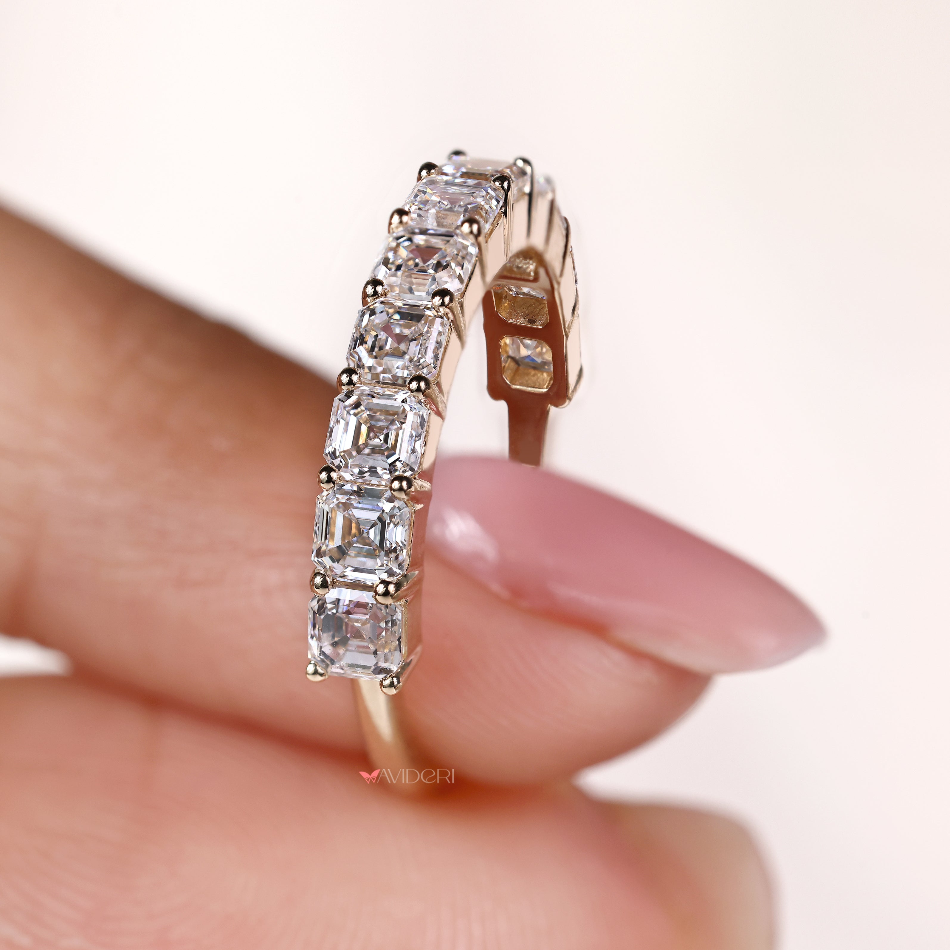 Semi eternity band featuring asscher diamonds in prong setting

