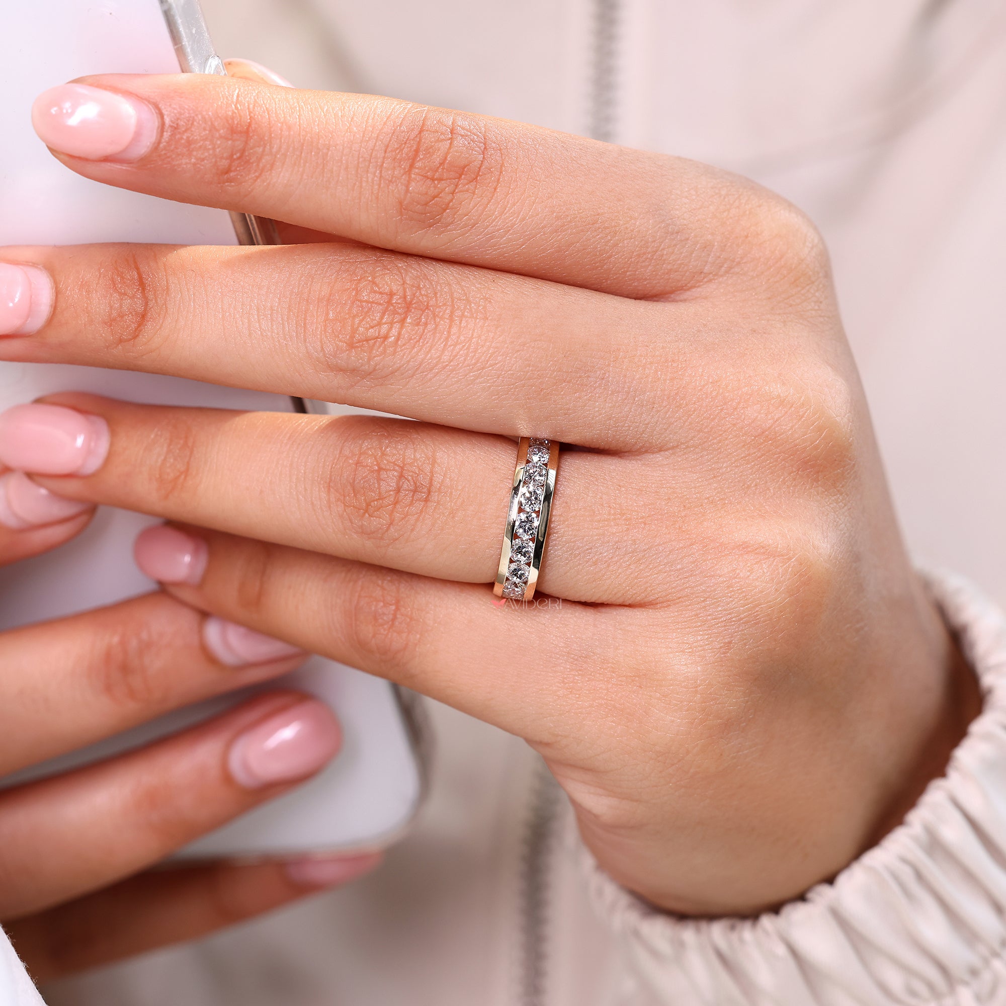 Round diamond wedding band with classic gold design.