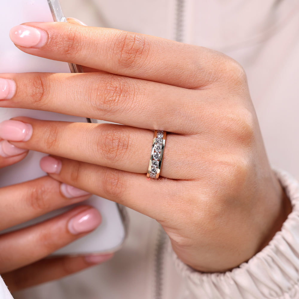 Round diamond wedding band with classic gold design.