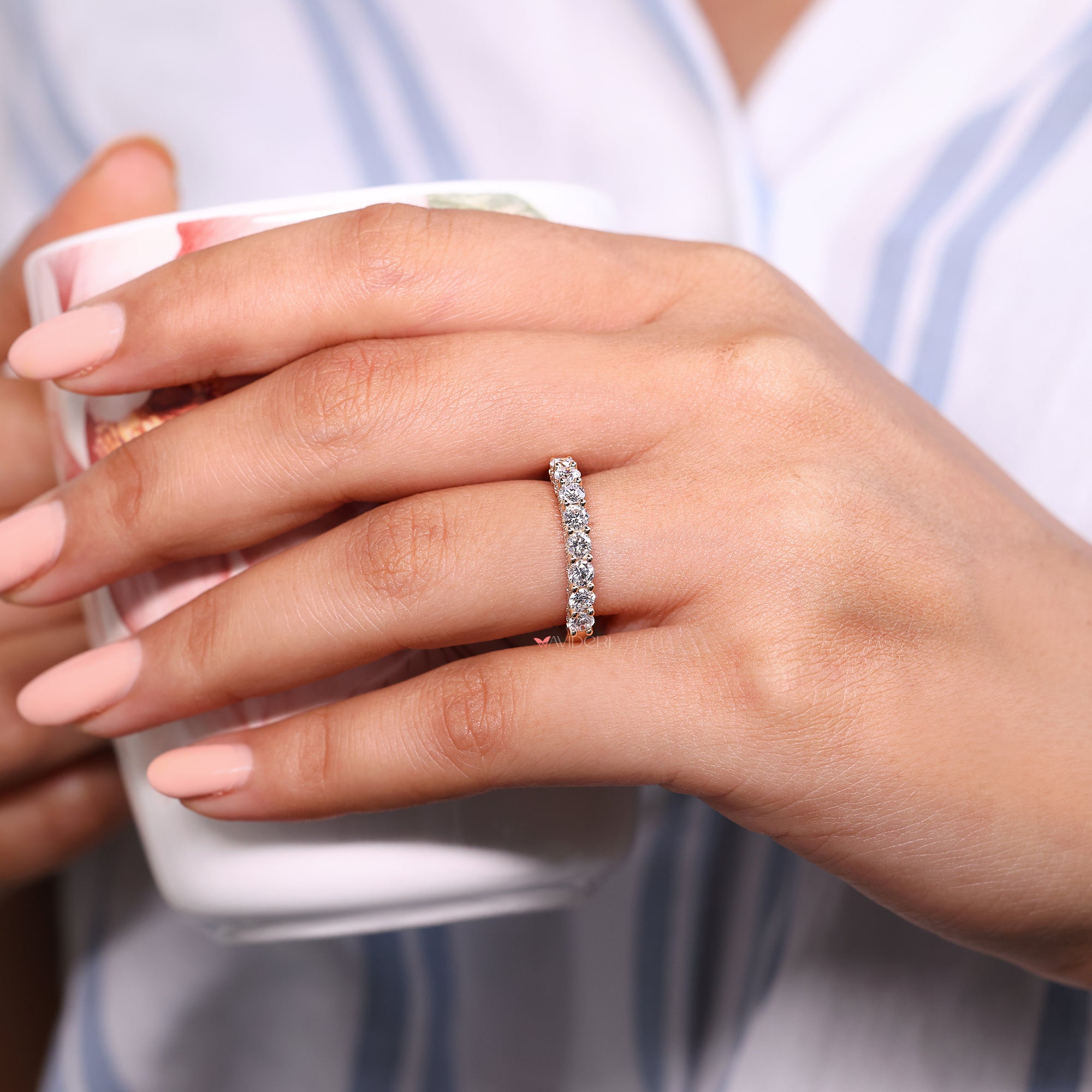 Round diamond wedding band in yellow gold.