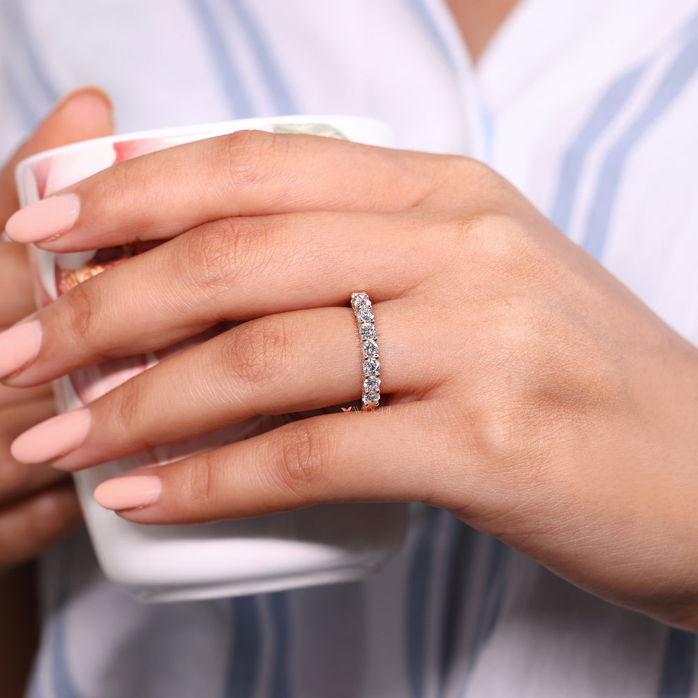 Round diamond wedding band in yellow gold.