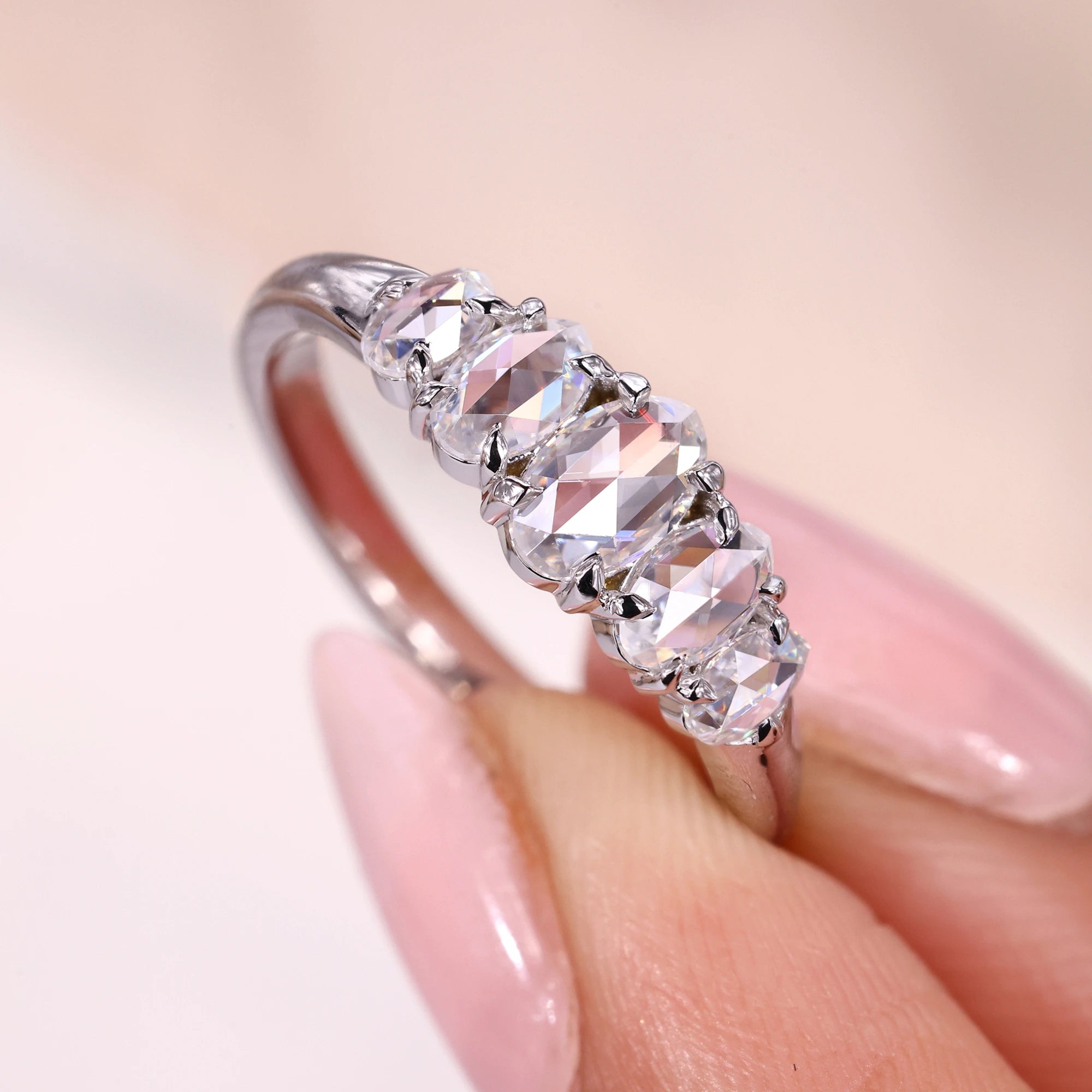 Half eternity wedding band with claw prong setting.