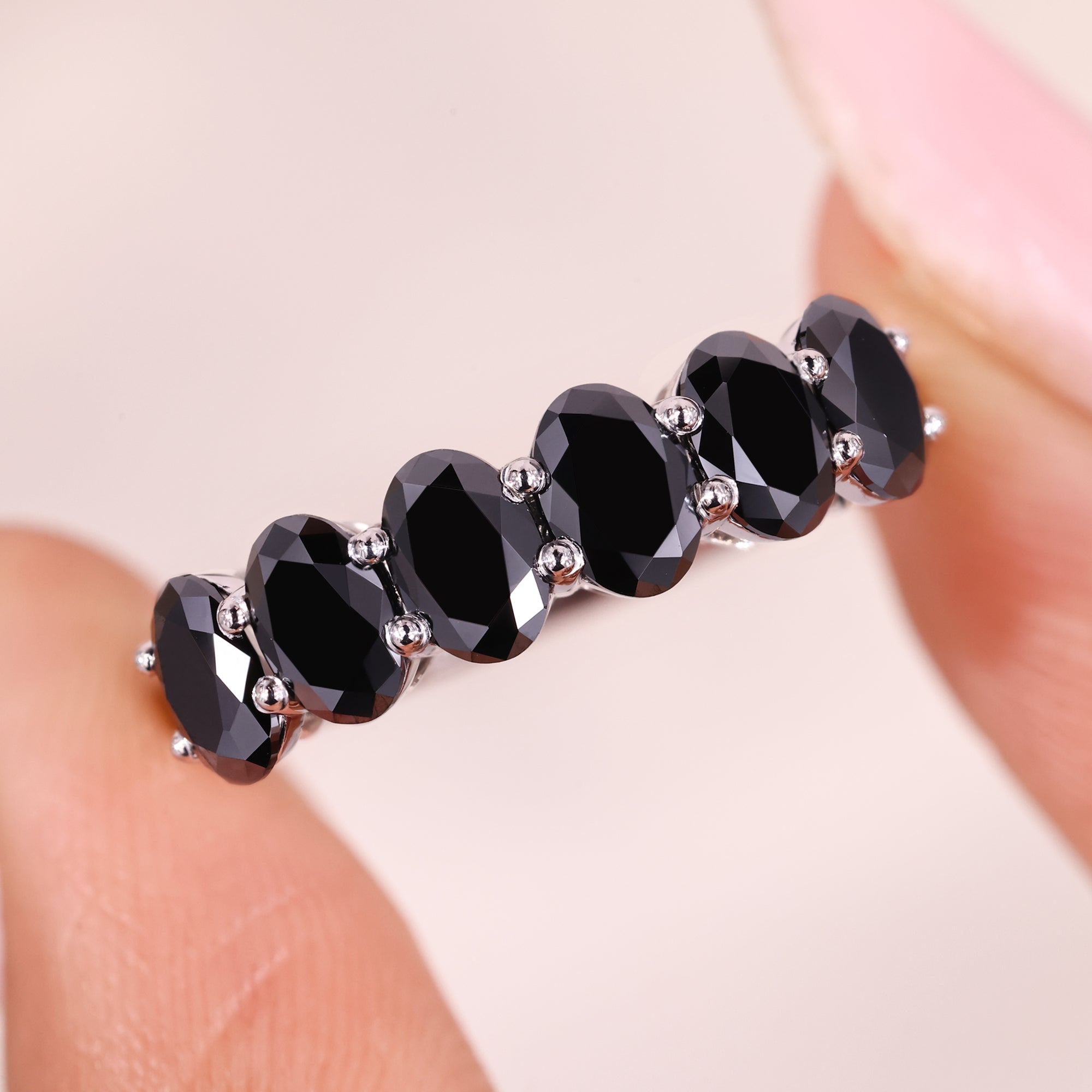 Oval cut wedding band in shared prong wedding band.