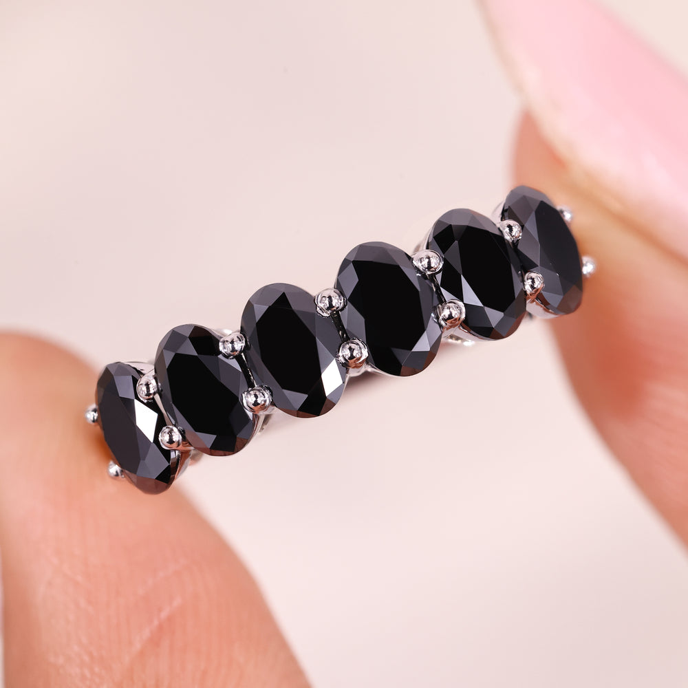 Oval cut wedding band in shared prong wedding band.