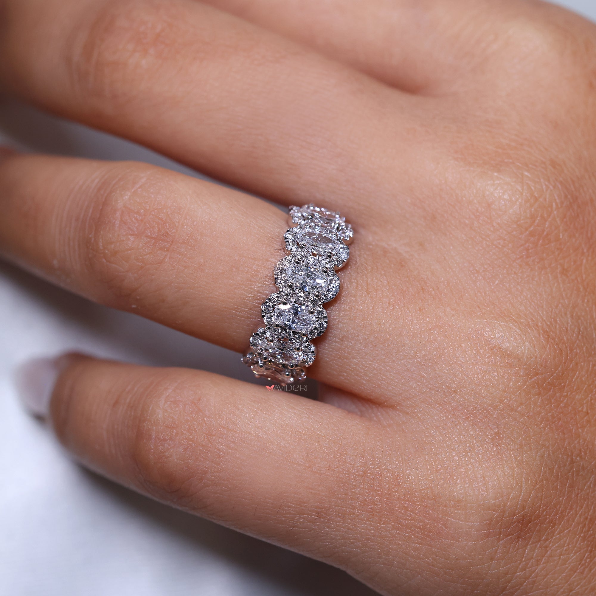 Handmade band with a halo setting.