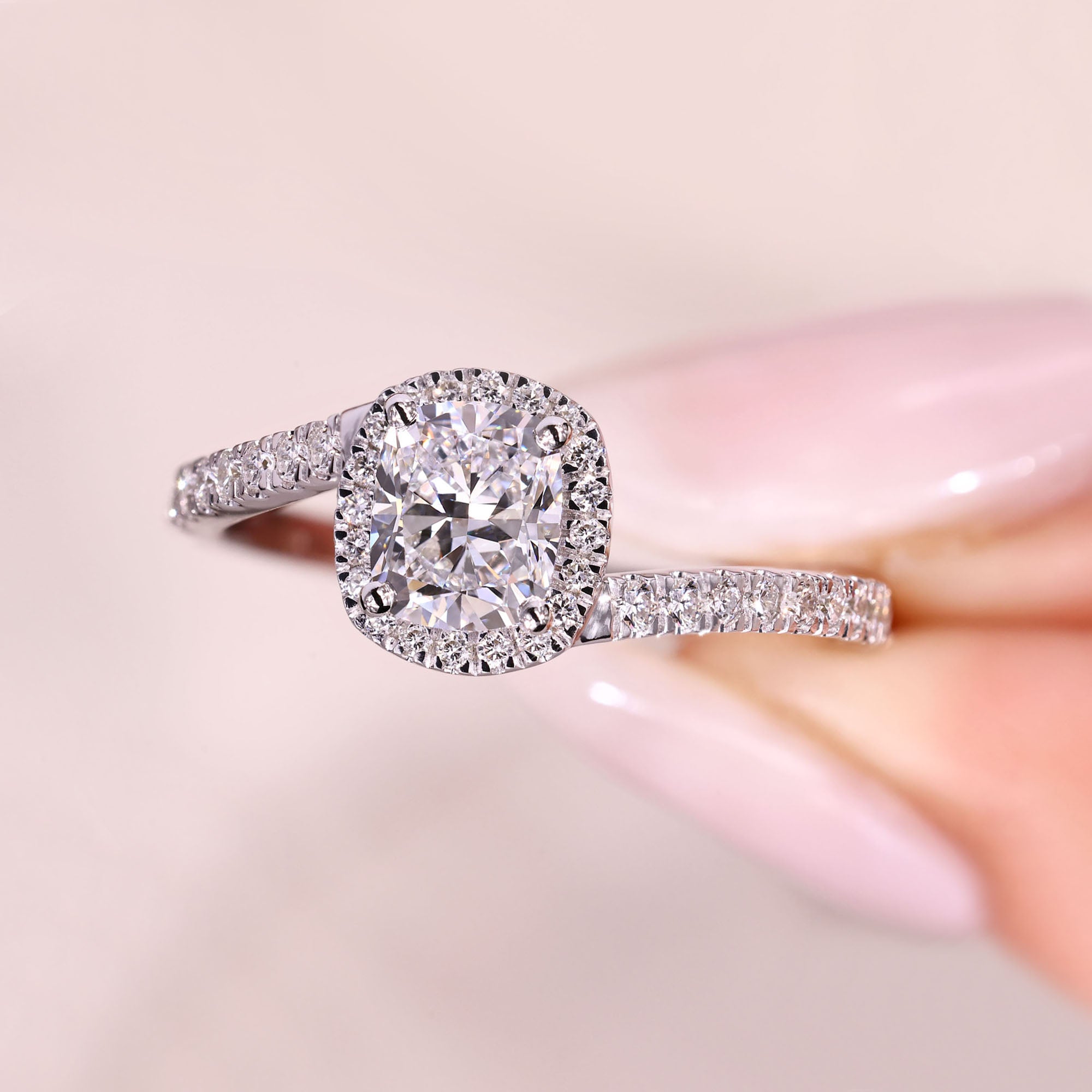 Lab grown cushion diamond ring with four prong setting.
