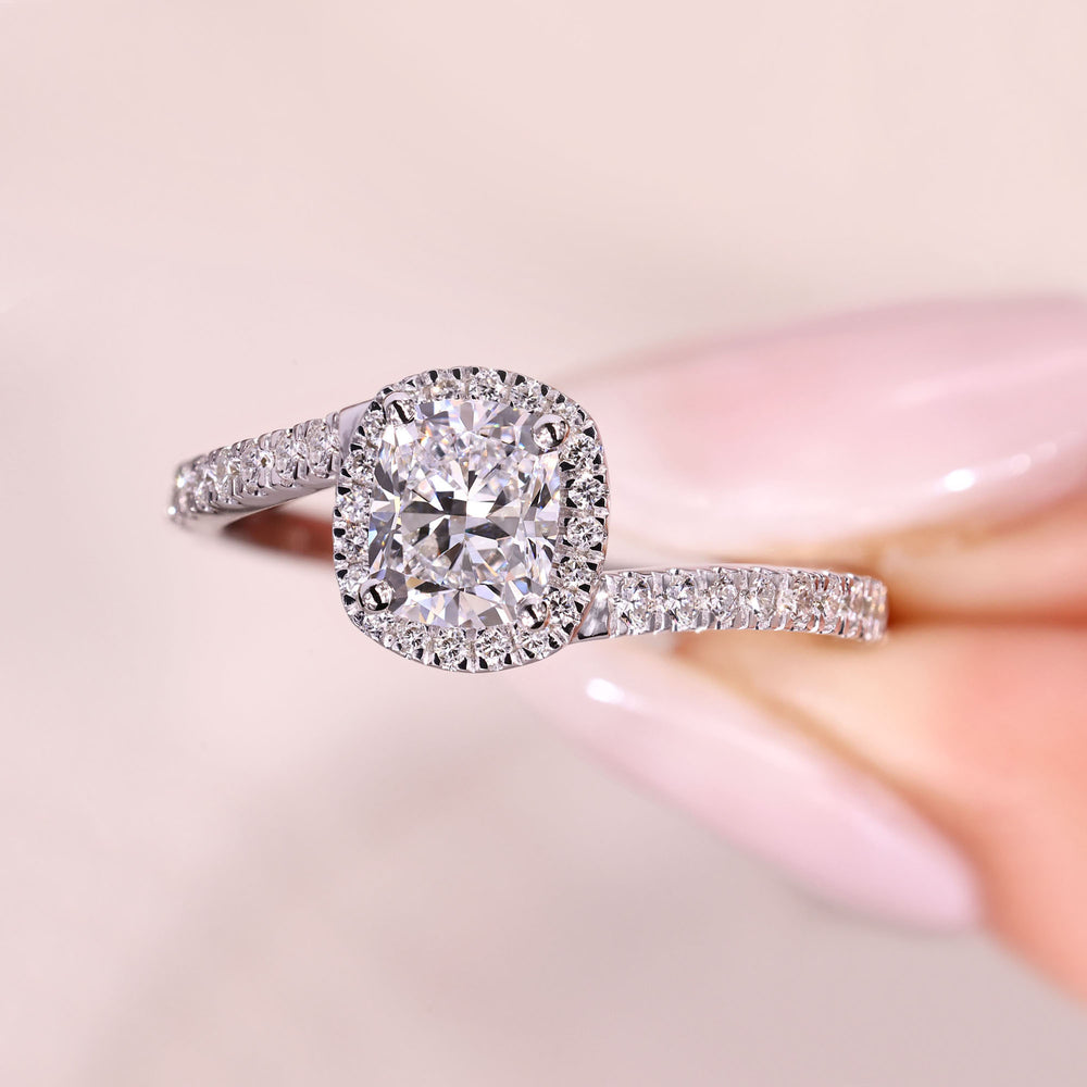 Lab grown cushion diamond ring with four prong setting.
