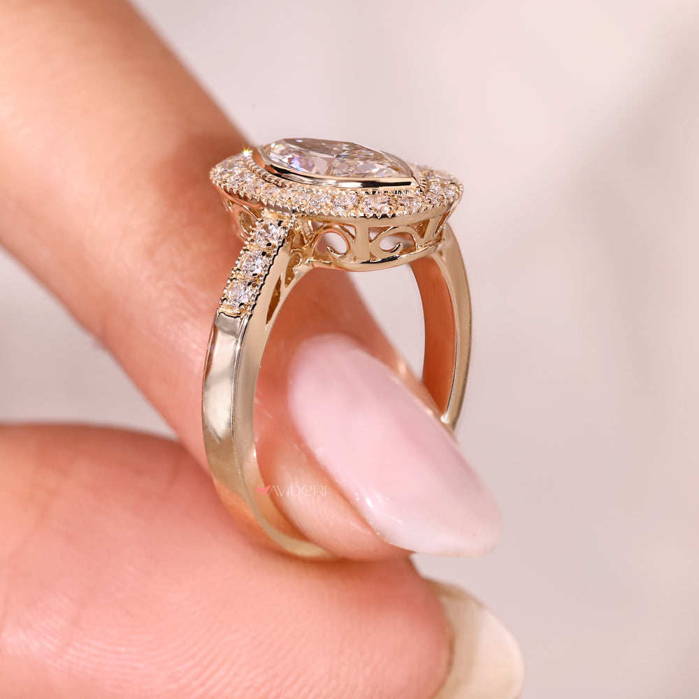 Marquise diamond ring with bezel and pave style.

