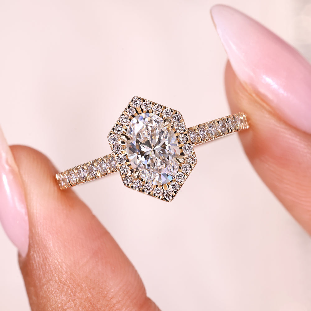 Halo pave oval diamond ring cathedral setting.
