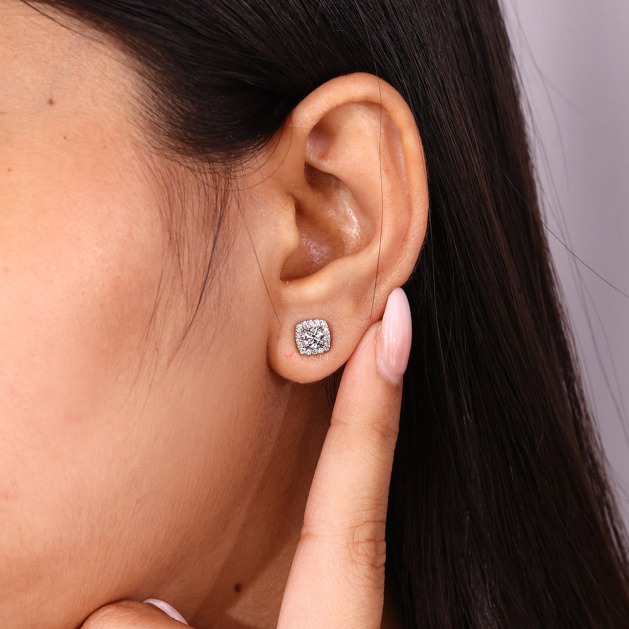 Handmade earrings with round cut diamonds.