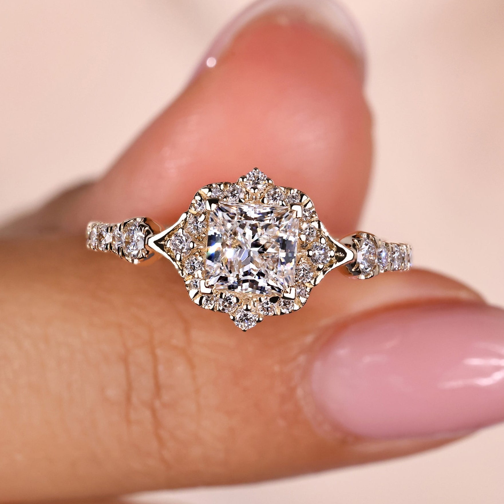 Princess cut diamond ring with round halo design.