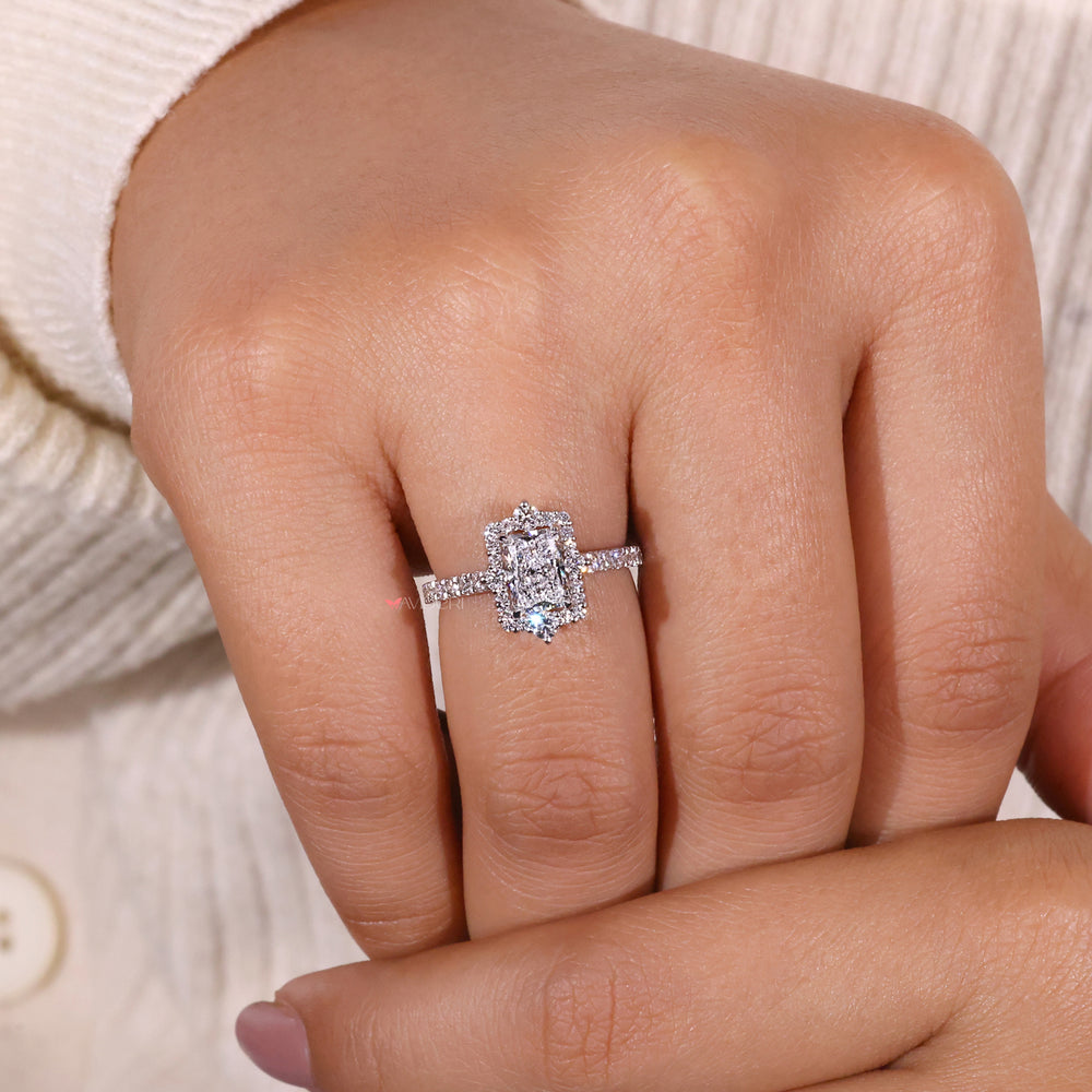 Handmade jewelry featuring a radiant diamond ring with intricate detailing.

