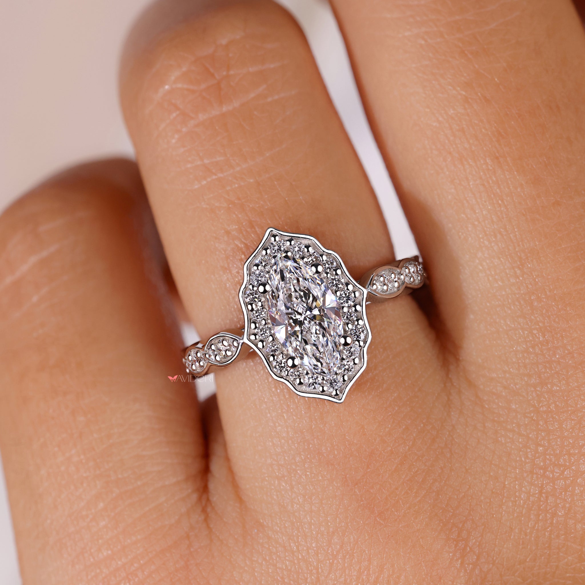 Handmade jewelry with a marquise cut diamond ring.
