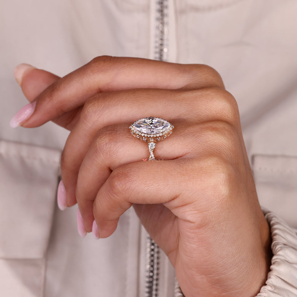 Marquise cut moissanite ring with twisted shank design.