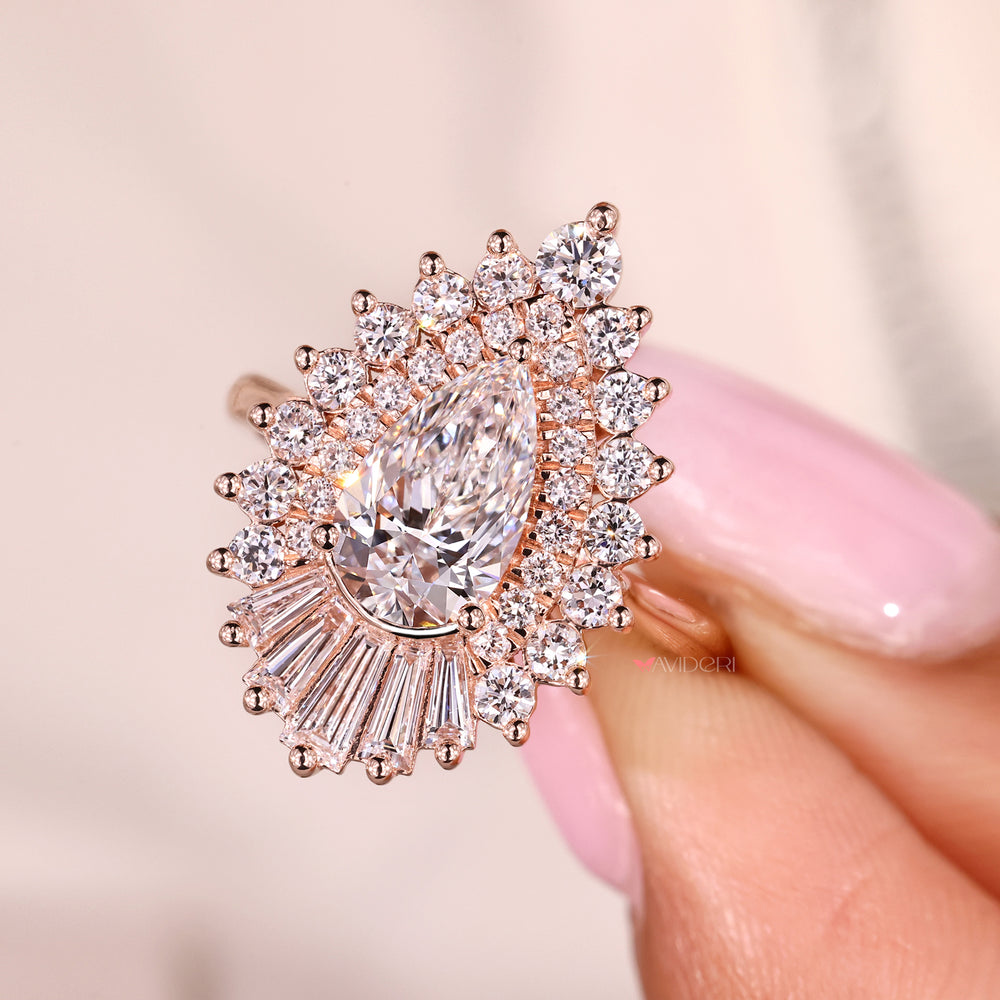 Handmade pear cut diamond ring with snowflake halo design.