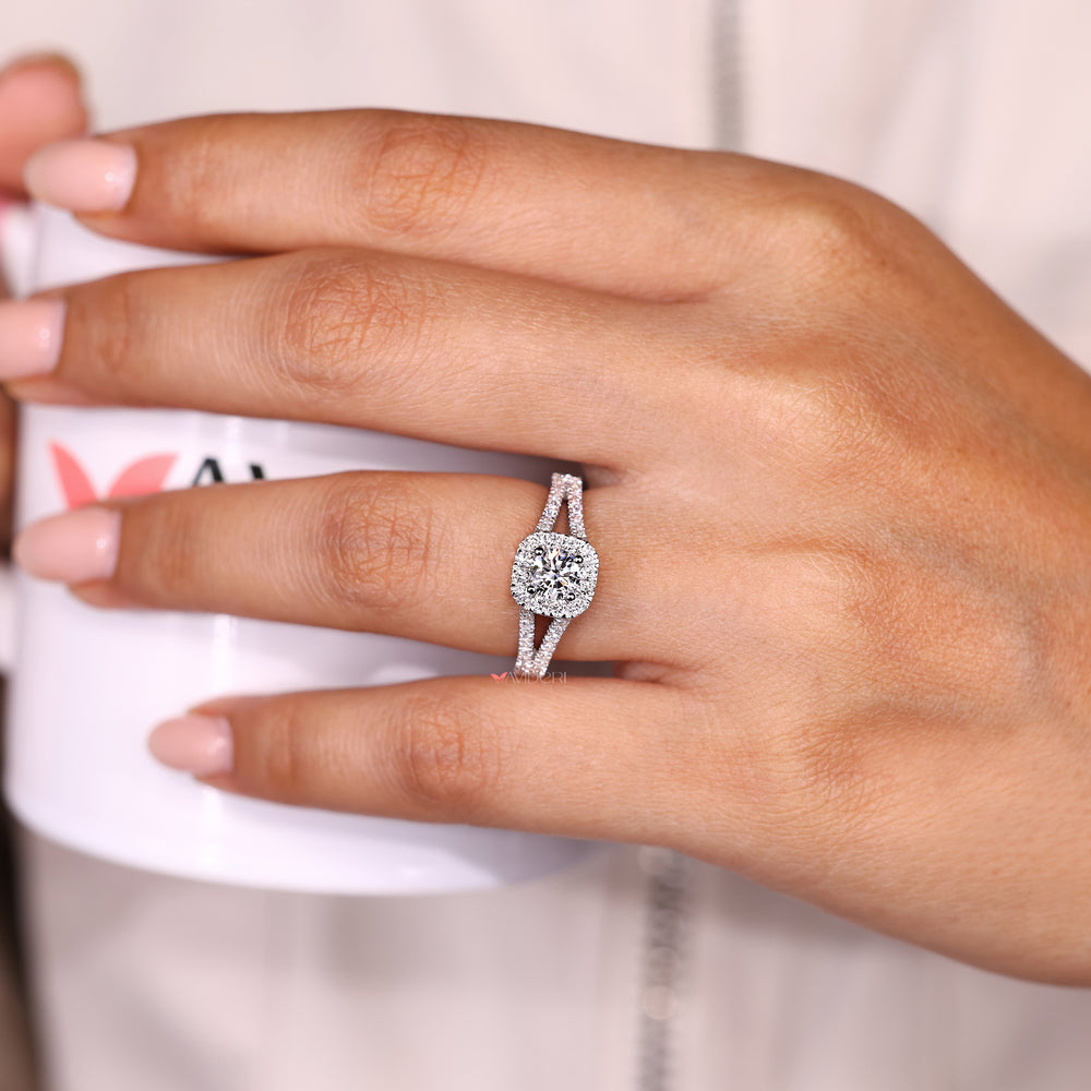 Halo style round diamond ring with pave band.
