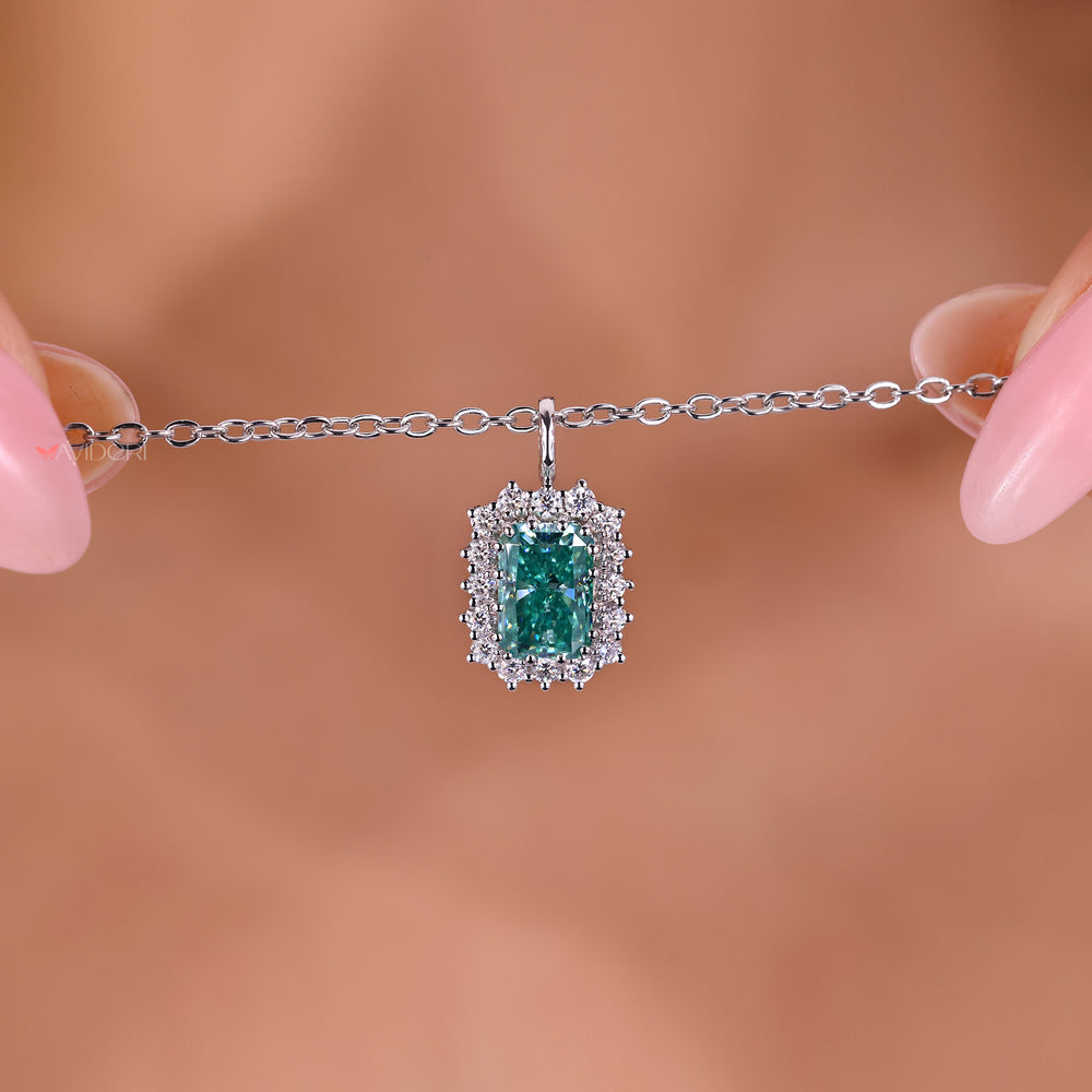 Radiant cut moissanite pendant with halo design.
