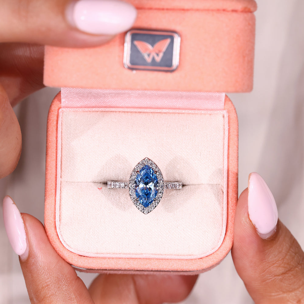 Lab grown blue diamond ring with cathedral style band
