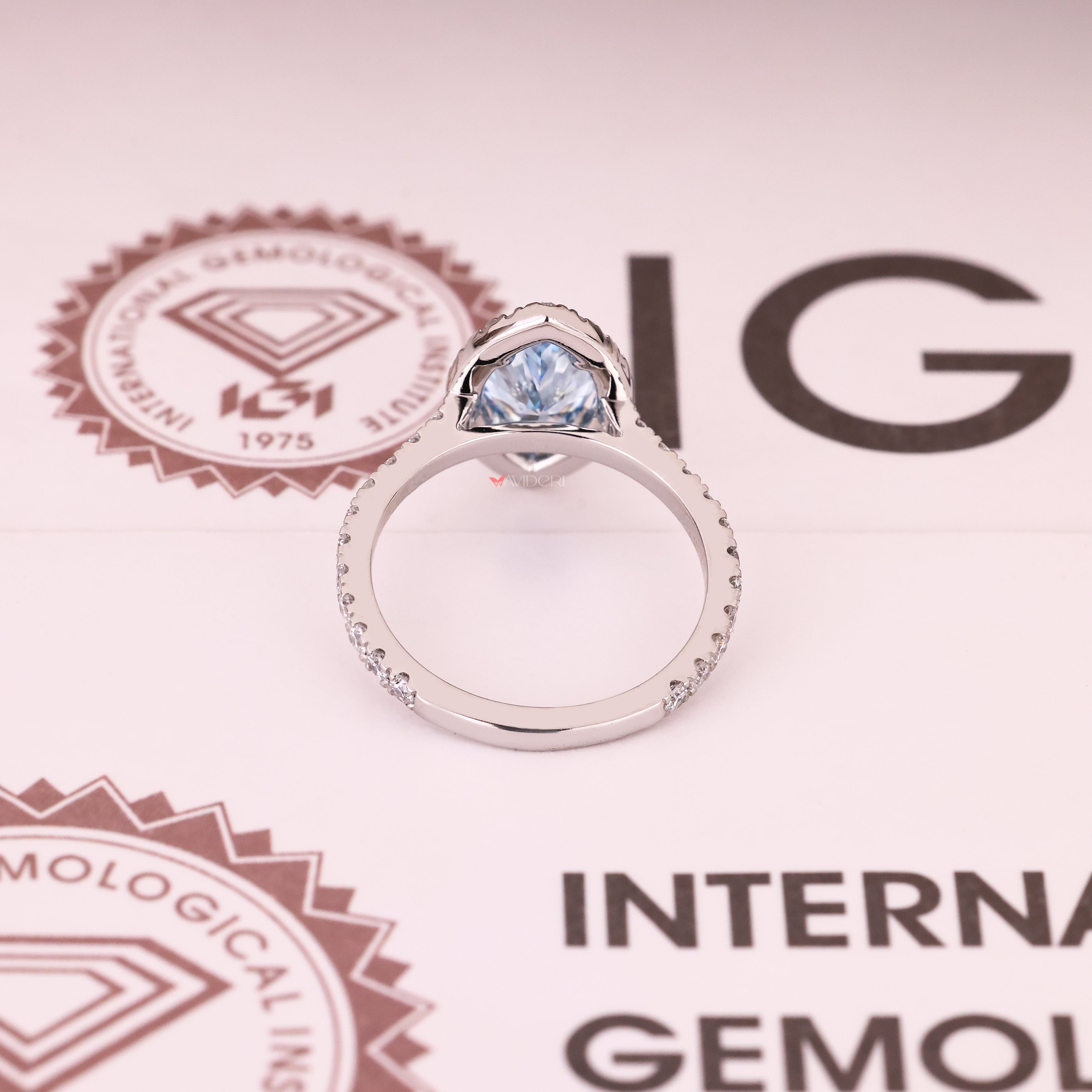 Marquise cut blue diamond ring with four claw prongs
