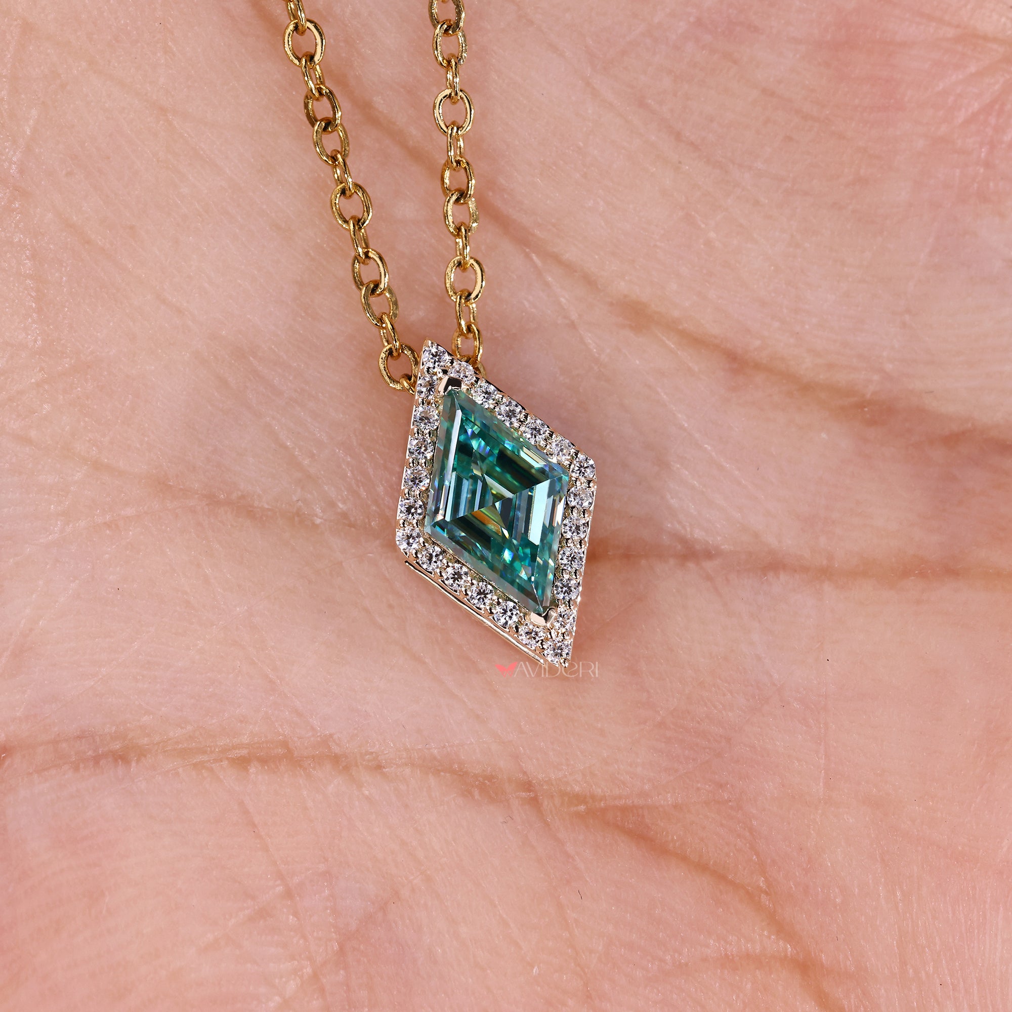 Minimal lozenge cut moissanite halo pendant.
