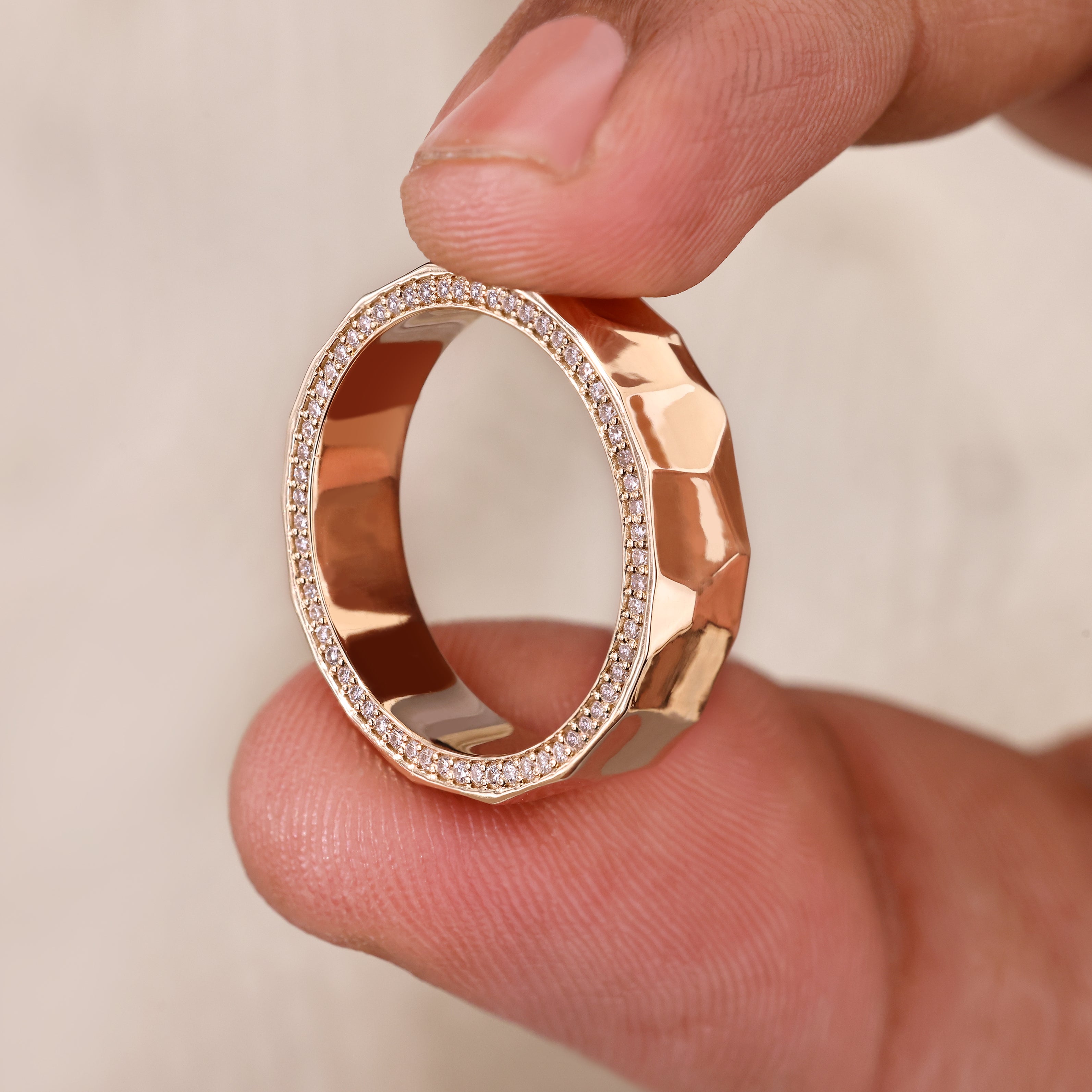 Handmade eternity band with hammered finish and diamond accents.
