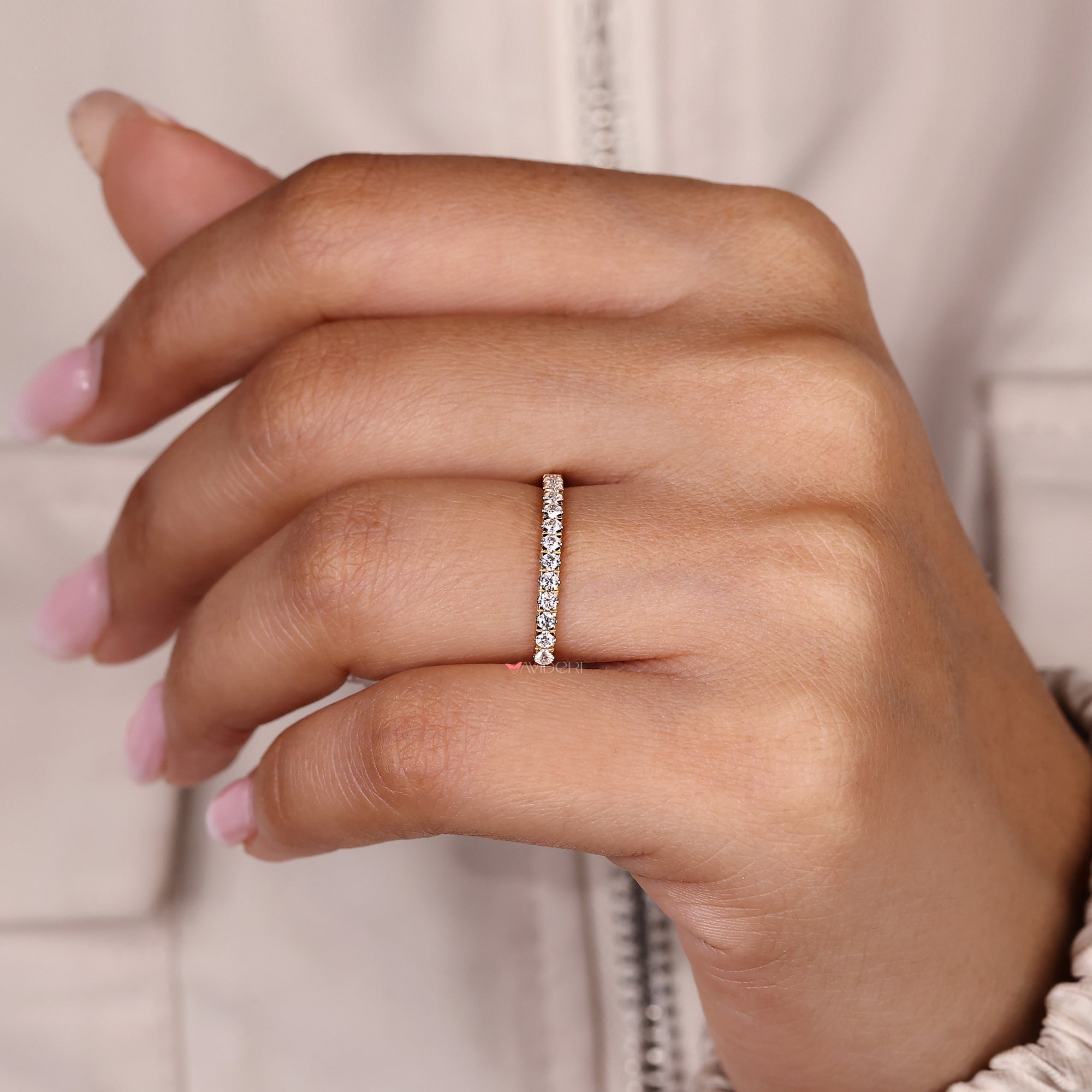 Minimalist wedding band offers sleek elegance with refined structure.