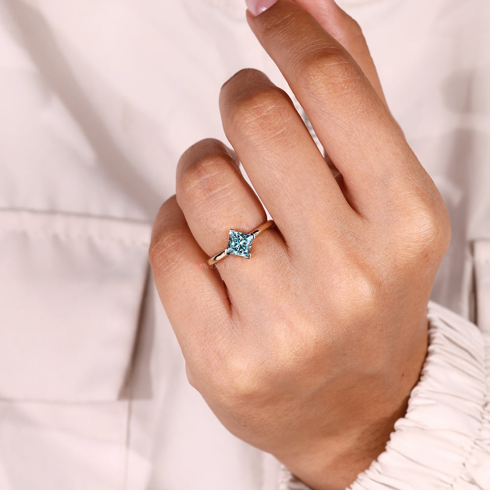 Princess cut ring with v prong solitaire style.
